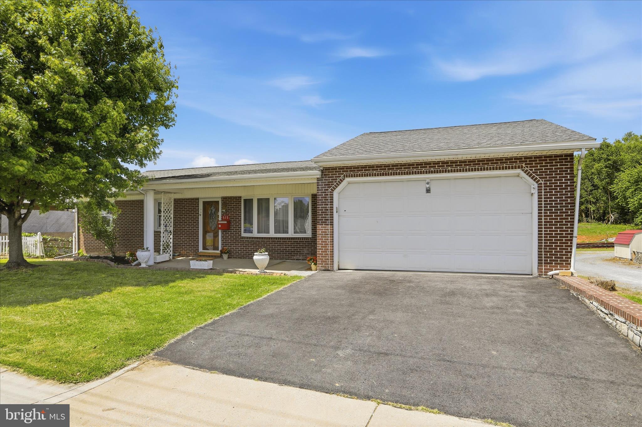 With the versatile living spaces and exceptional outdoor storage options, this property offers far more than meets the eye! Originally designed as a 3 bedroom home, two bedrooms were combined to create an oversized primary bedroom, and the home is currently configured as a spacious 2 bedroom layout. The upper level features a full bath, spacious living room room, and a kitchen with a charming built-in window bench with storage underneath, creating the perfect opportunity for a cozy breakfast nook.  Off of the kitchen, there are also washer and dryer hookups, offering the convenience of main level laundry. The attached 2-car garage is conveniently accessible directly from inside the home. 

The lower basement level offers exceptional flexibility with a finished living area, full bath, exterior entrance, laundry hookups, and plumbing already in place for a future sink installation. An egress window adds additional potential and functionality to the space, making it ideal for guests, extended living arrangements, hobby space, or future customization. 

Outside, this property continues to impress with a detached 2 car garage, pole building, and additional RV storage/port space,  all with electricity, providing endless possibilities for storage, workshop use, recreational equipment, car enthusiasts, or hobby needs. Situated on just over a quarter of a acre, with convenient access to I-81, shopping, dining, and everyday conveniences, this property offers a rare blend of versatility, workspace potential, and comfortable living. Come explore everything this unique property has to offer!