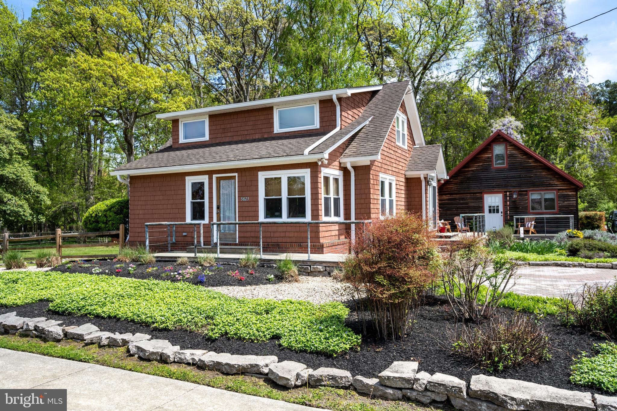 Welcome to your slice of the Chesapeake Bay lifestyle! Nestled in the quaint, walkable town of Rock Hall—just steps from marinas, waterfront, dining, and shops—this 3-bedroom, 2-bath coastal cottage offers the perfect blend of charm, comfort, and flexibility. Whether you're searching for a weekend retreat, a year-round residence, or a smart investment property, this one checks all the boxes.
Step inside and feel instantly at ease. This well-maintained home features light-filled living spaces, an easy-flow layout, and thoughtful updates throughout. The updated kitchen has newer stainless appliances, the dining area and reading nook are ideal for gatherings and lively games, while the main level bedroom offers a quiet place to recharge after a day on the water. The two large bedrooms upstairs have room for plenty, and the full bath has a soaking tub to unwind.
Outside, enjoy laid-back afternoons on the expansive back deck—perfect for grilling, crab picking, or simply taking in a Bay breeze. The partially fenced rear yard offers privacy and room for the pups, and to play or garden, enhanced by low-maintenance landscaping that lets you focus on fun, not work. The shed is four years new and offers storage for water toys, yard games, and boating necessities.
But here’s the best part: a separate 2-bed, 1-bath potential income unit gives you the opportunity to generate revenue while you relax. This could be ideal for short-term vacation rentals, hosting guests, or even a home office or studio. One spacious bedroom is conveniently located on the main level, along with a full bathroom and a vaulted-ceiling living room that adds a sense of openness and light. A charming spiral staircase leads to the loft, where you'll find a second, oversized bedroom—ideal as a bunk room, with ample space for multiple large beds.
Live where others vacation. Walk or bike to the harbor, charter a sunset sail, jump on your boat that is nearby at a marina, or paddle out from a nearby launch. Rock Hall is known for its friendly community, laid-back vibe, and stunning beach sunsets—and this home puts you right in the heart of it all.
Don't miss this rare opportunity to own a turn-key home with coastal character and rental income potential in one of Maryland Eastern Shore’s most beloved waterfront towns. [Some furnishings and décor available, too! To be discussed outside of the contract of sale.]