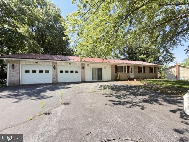 Price change due to pre-foreclosure status. Do not let this stop you from coming to take a look. Plenty of time to view and purchase. Water is off- do not use any facilities- home has been winterized. Home is in general good condition. Selling strictly "AS-IS & Where is" Sellers will make no repair. Welcome to 844 Knob Hill Rd! Nestled on a .34-acre lot in a quiet, wooded neighborhood. This warm and welcoming 3-bedroom, 3-bathroom home is thoughtfully designed for family living or those looking to downsize. Pervious owner finished one garage bay as living space. This amazing space can be used for a large bedroom, while current owners decided to use it for a spacious living room for their busy family! Down the central hall features two additional bedrooms, one with an ensuite bath and  a hall bath.  The updated kitchen features sleek cabinetry and quartz countertops, perfect for busy mornings and weekend gatherings. The first-floor laundry adds everyday convenience. Hardwood floors and open concept kitchen, living room, dining room areas have a fresh and modern look.  A finished basement offers flexible space for additional bedroom, play, work, or relaxation. The shaded, fenced backyard is ideal for kids, pets, and outdoor fun. Further upgrades include a durable metal roof with a lifetime warranty, offering long-term peace of mind. With easy access to Route 30 and I-81, plus nearby shopping, this home combines comfort, functionality, and location—making it a smart and inviting choice for families ready to settle into something special or those looking to downsize and live on one level. Two car attached garage and a garden shed in back allow great space for parking and outdoor storage. Cash or Conventional financing is best.