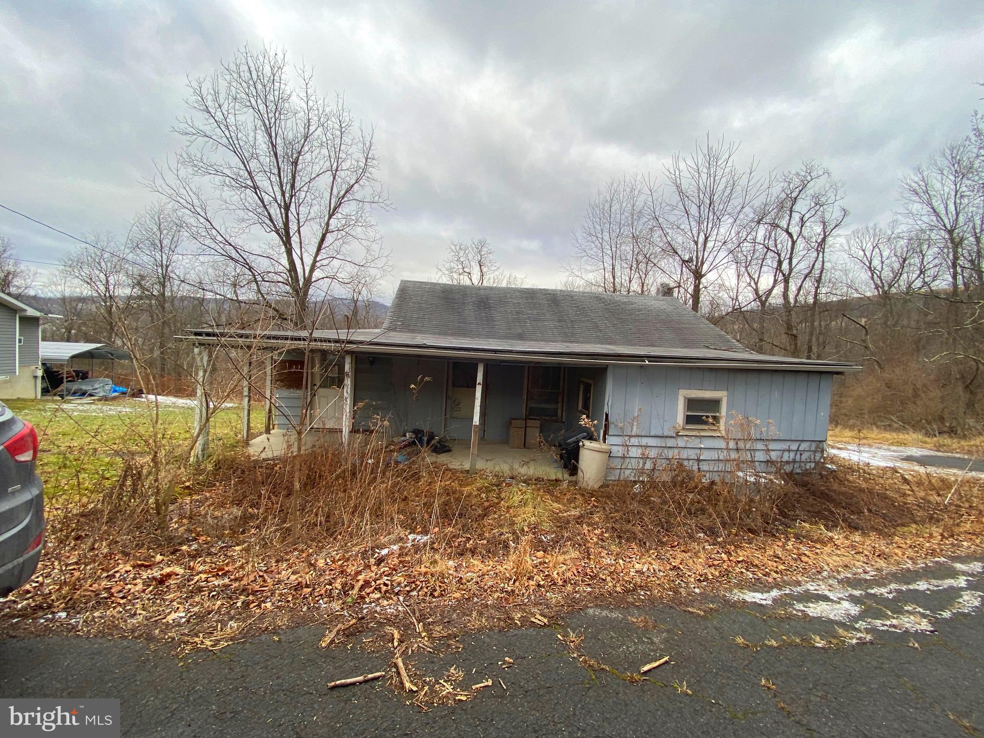 Great potential on this home.  Cute home that feels much larger inside. Finish the home to your own liking. Nice lot that backs to trees.  The home needs work and sold "As-Is, Where-Is" The value is in the land here, not the home.  Come take a look, and bring your best offer!
