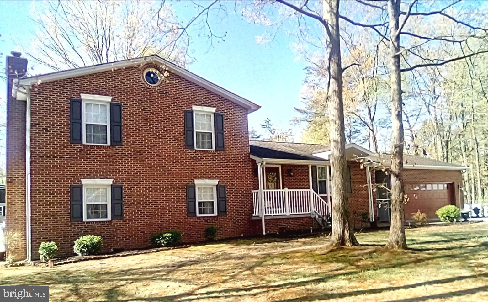 ENJOY COUNTRY LIVING WITH SCHOOLS AND SHOPPING NEARBY!  Experience the perfect blend of comfort and convenience in this delightful home, where every detail has been thoughtfully considered for your enjoyment. Welcome to this beautifully updated home that includes an oversized attached 2-car garage plus an oversized detached 2-car garage with 9-foot doors for taller vehicles, a 14x28 foot garage/shed with loft space and an additional shed for lawn equipment. This home offers tons of storage space for mechanics, car collectors, crafts and hobbies. A whole house generator provides backup power. The many features of this home also include hardwood and ceramic tile flooring, plus natural light that floods the space through skylights, enhancing the warm ambiance in the kitchen and sunroom. The heart of the home is the large, well-appointed kitchen, equipped with stainless steel appliances, 42-inch cabinets and granite countertops. A masonry fireplace with a gas insert awaits you in the spacious lower-level family room. Enjoy outdoor living on the expansive deck or screened gazebo, ideal for summer barbecues or quiet mornings with a cup of coffee. With a finished basement featuring a walkout entrance, this home offers endless possibilities. TAX ID 090612351 is also included with the property. The septic tank, furnaces and ductwork were cleaned in April 2026. *NO HOA* The owner is a licensed real estate agent. **A ONE-YEAR HOME WARRANTY IS PROVIDED**Call for details about how you can save when you finance your dream home with special financing**