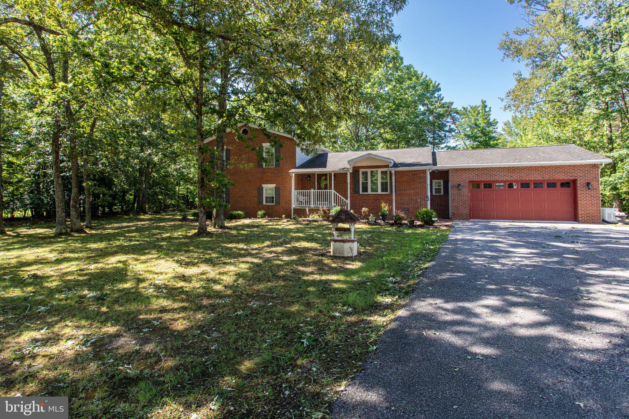 ENJOY COUNTRY LIVING WITH SCHOOLS AND SHOPPING NEARBY!  Experience the perfect blend of comfort and convenience in this delightful home, where every detail has been thoughtfully considered for your enjoyment. Welcome to this beautifully updated home that includes an oversized attached 2-car garage plus an oversized detached 2-car garage with 9-foot doors for taller vehicles, a 14x28 foot garage/shed with loft space and an additional shed for lawn equipment. This home offers tons of storage space for mechanics, car collectors, crafts and hobbies. A whole house generator provides backup power. The many features of this home also include hardwood and ceramic tile flooring, plus natural light that floods the space through skylights, enhancing the warm ambiance in the kitchen and sunroom. The heart of the home is the large, well-appointed kitchen, equipped with stainless steel appliances, 42-inch cabinets and granite countertops. A masonry fireplace with a gas insert awaits you in the spacious lower-level family room. Enjoy outdoor living on the expansive deck or screened gazebo, ideal for summer barbecues or quiet mornings with a cup of coffee. With a finished basement featuring a walkout entrance, this home offers endless possibilities. TAX ID 090612351 is also included with the property. The septic tank, furnaces and ductwork were cleaned in April 2026. *NO HOA* The owner is a licensed real estate agent. **A ONE-YEAR HOME WARRANTY IS PROVIDED**Call for details about how you can save when you finance your dream home with special financing**