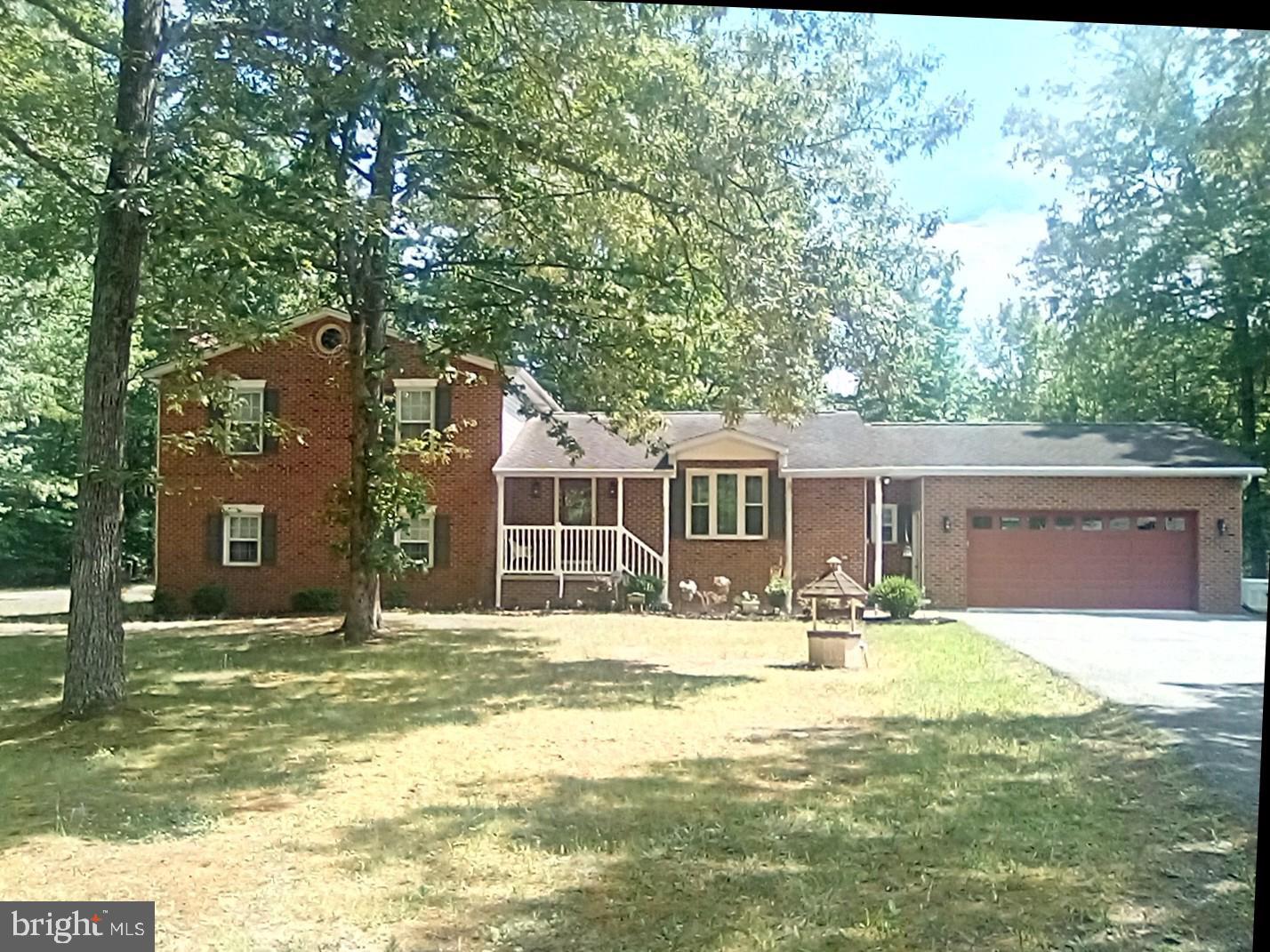 ENJOY COUNTRY LIVING WITH SCHOOLS AND SHOPPING NEARBY!  Experience the perfect blend of comfort and convenience in this delightful home, where every detail has been thoughtfully considered for your enjoyment. Welcome to this beautifully updated home that includes an oversized attached 2-car garage plus an oversized detached 2-car garage with 9-foot doors for taller vehicles, a 14x28 foot garage/shed with loft space and an additional shed for lawn equipment. This home offers tons of storage space for mechanics, car collectors, crafts and hobbies. A whole house generator provides backup power. The many features of this home also include hardwood and ceramic tile flooring, plus natural light that floods the space through skylights, enhancing the warm ambiance in the kitchen and sunroom. The heart of the home is the large, well-appointed kitchen, equipped with stainless steel appliances, 42-inch cabinets and granite countertops. A masonry fireplace with a gas insert awaits you in the spacious lower-level family room. Enjoy outdoor living on the expansive deck or screened gazebo, ideal for summer barbecues or quiet mornings with a cup of coffee. With a finished basement featuring a walkout entrance, this home offers endless possibilities. TAX ID 090612351 is also included with the property. The septic tank, furnaces and ductwork were cleaned in April 2026. *NO HOA* The owner is a licensed real estate agent. **A ONE-YEAR HOME WARRANTY IS PROVIDED**Call for details about how you can save when you finance your dream home with special financing**