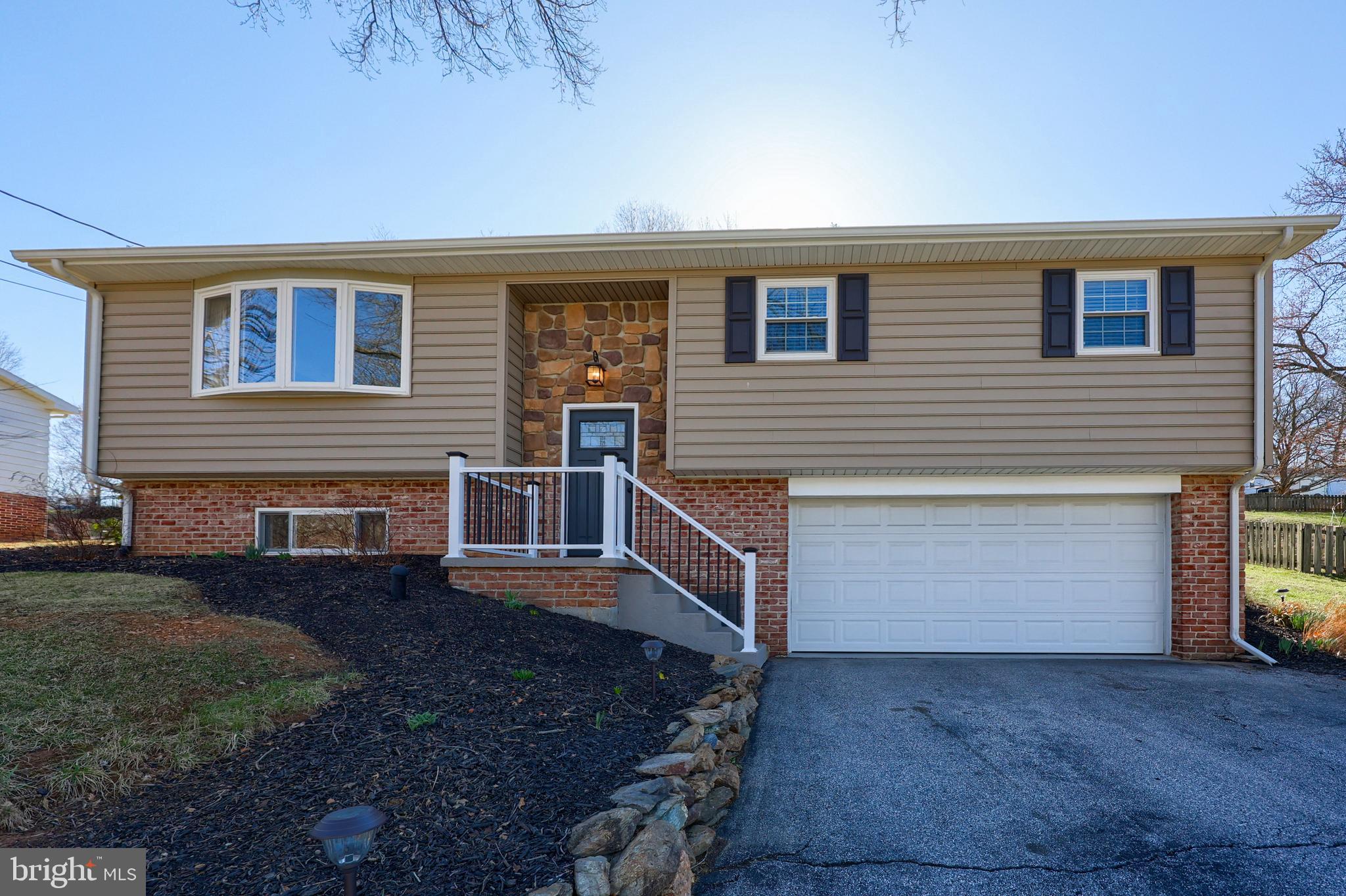 This stunning split-level home has been meticulously renovated. The open concept allows natural light to flow throughout the home enhancing the warmth and cozy atmosphere that exists. As you walk through the spacious rooms take note of the well thought out updates including light fixtures, stair railings, flooring a fully renovated kitchen open to the dining room and rec room with fireplace . The spacious primary bedroom boasts a walk in closet and access to the full bathroom. A neutral palette has been utilized, allowing you to add your special touches, making this the home of your dreams.  As you step out to the rear patio, take note of the covered patio and fantastic yard, great for entertaining in any weather. There is also a large 12x16 shed. With 3 bedrooms, 2 full baths, 2 car garage with  work bench area and new hot water zoned heating system installed Nov 2023, this home has it all!