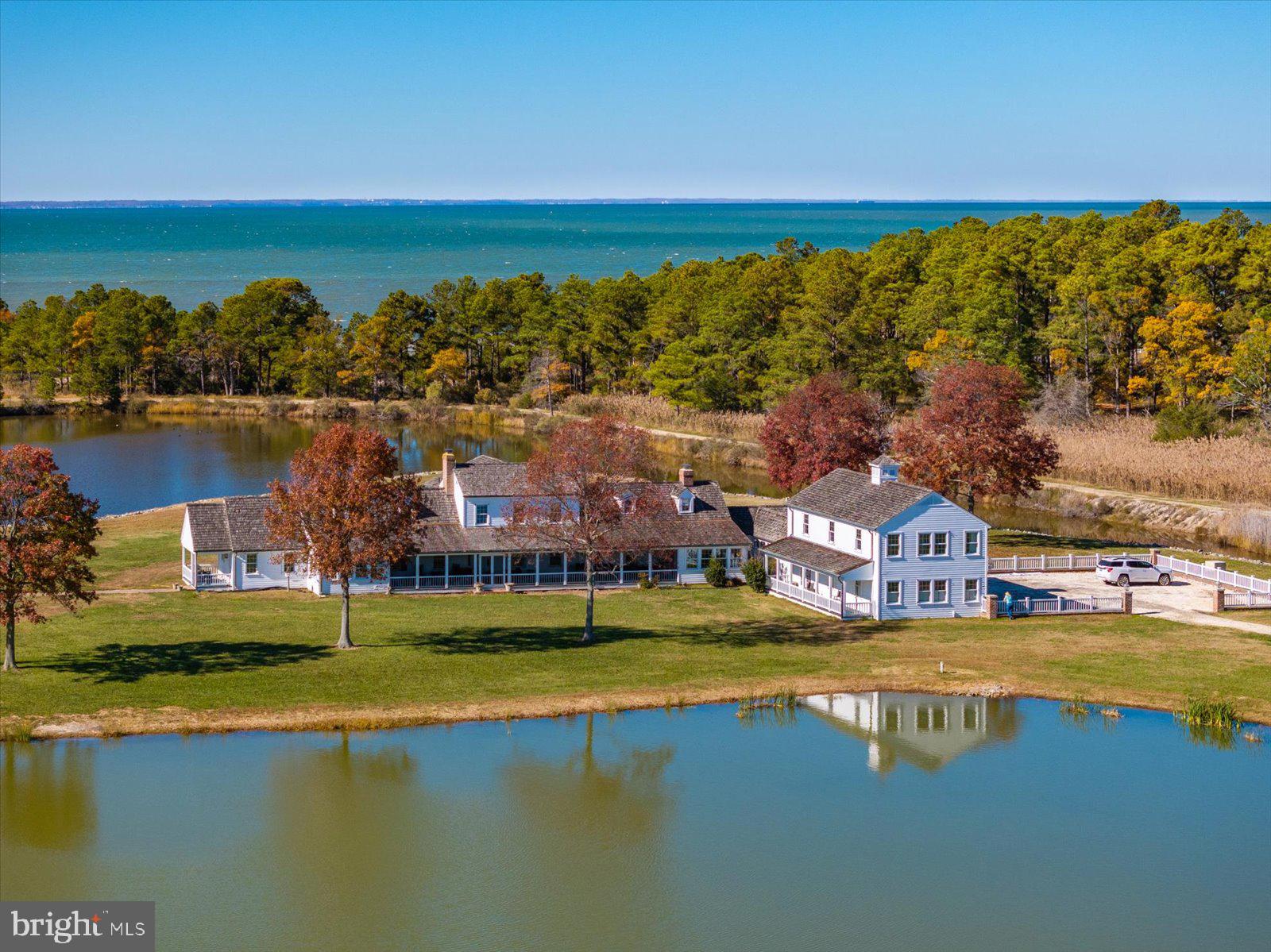 Parsons Creek Farm - A 255+/- Acre, Multi-Residence, Deep-Water, Waterfowl & Wildlife Estate at the Confluence of Parsons Creek and the Little Choptank River

This once-in-a-lifetime Chesapeake Bay legacy holding is set upon 255.47 extraordinary acres of waterfront, wetlands, upland forest, and meticulously curated wildlife habitat making Parsons Creek Farm one of the most sophisticated private estates on Maryland's Eastern Shore. Masterfully blending historic charm, modern craftsmanship, high-performance land management, and recreational luxury, this turnkey, multi-residence compound stands unrivaled in scale, ecological design, and architectural execution. Positioned at the union of Parsons Creek and the Little Choptank River, the property enjoys nearly a mile of sandy, private shoreline, deep-water access, expansive water vistas, and complete seclusion - yet remains within a short drive to Cambridge, Annapolis, Baltimore, Washington, and the greater Mid-Atlantic corridor. 

A series of thoughtfully positioned structures - each with its own architectural identity - combine to create a private compound capable of sleeping more than 24 guests in total comfort. Elegantly sited to capture uninterrupted views across impoundments, woodlands, and water, the primary residence blends historic Maryland character with refined luxury. This meticulously designed, 9,583 sq. ft. luxury residence boasts an impressive array of distinct living areas, creating a home of both grand scale and exceptional comfort for family living and entertaining. The expansive property also features a charming, fully renovated, private 1,500 sq. ft. Cape Cod–style guest house that extends a warm welcome to visitors, and a third two-story residence complete with a full bedroom suite, full bathroom, laundry, and sweeping picture windows overlooking one of the ponds. Part of the estate's recreational opportunities is an over-the-water bar and game room, a gathering place where family and friends can cast a line into the pond while enjoying the comforts of a private lounge. Equestrian enthusiasts and entertainers alike will appreciate the impressive stable complex, complete with second-floor luxurious living quarters, a spacious game room, and full bar. Balconies at each end capture sweeping views of the surrounding woodland and water, creating an atmosphere of timeless elegance. 

Whether envisioned as a generational family compound, a private sporting estate, a conservation-forward investment property, or an exclusive corporate/hospitality retreat, Parsons Creek Farm offers a combination of luxury, ecological engineering, and rural waterfront beauty unmatched anywhere in the Mid-Atlantic. This remarkable waterfront estate is a unique opportunity that unites world-class waterfowl and upland hunting, meticulous wildlife management, and refined living—enhanced by impressive income potential. Having identified his replacement property, the seller is prepared to move forward and welcomes qualified offers.