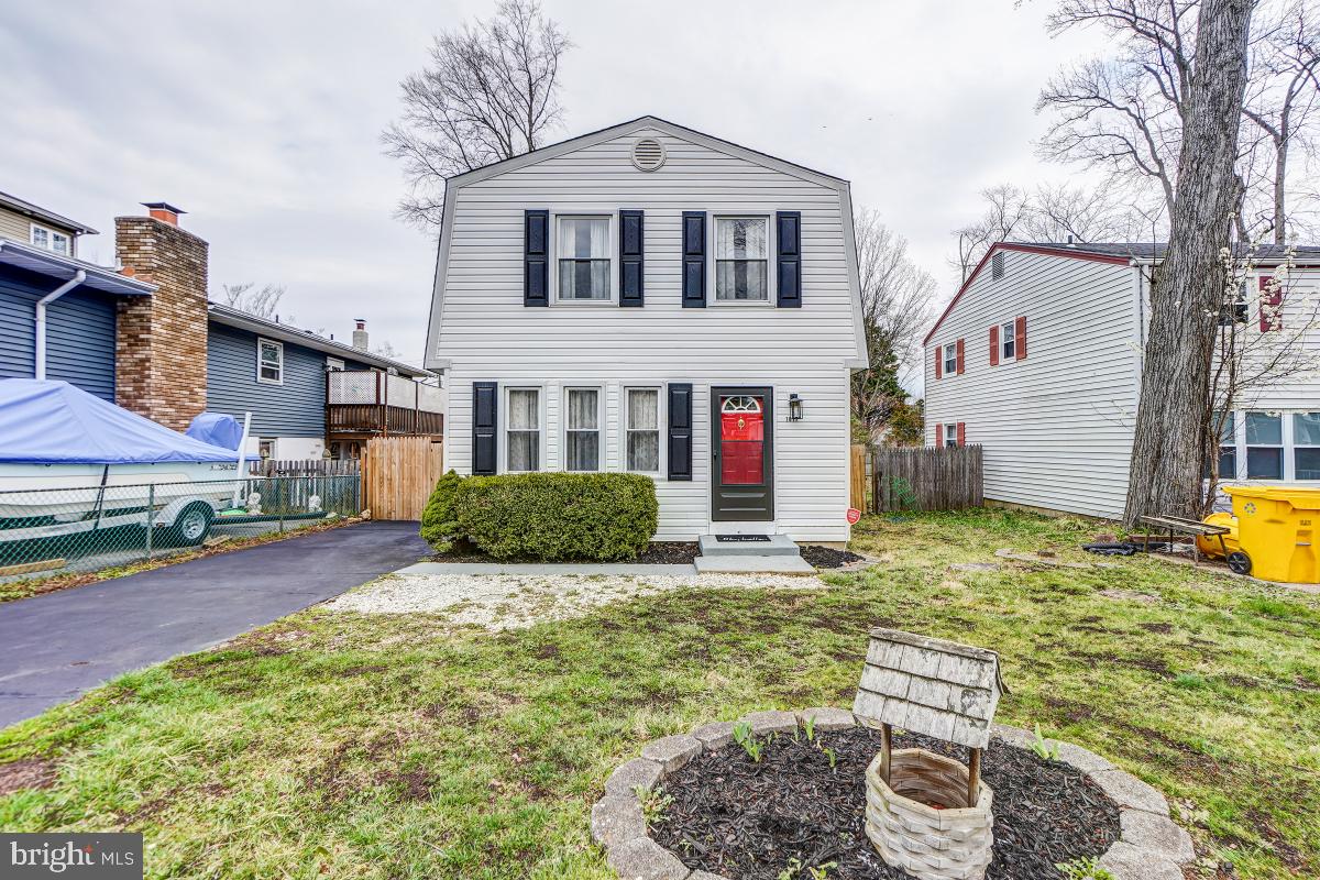 Lovely updated colonial with water privileges in desirable Woodland Beach/London Towne with access to 5 beaches.  Just a two minute walk to the water and close to Annapolis.  Three bedrooms, 2 baths, fenced flat yard and beautiful updates including an eat in gourmet kitchen.  With sunroom addition, square footage over 1700 feet above grade.
Floor plan has been opened up and a bath added by the current owners.
Beautiful new LVP flooring runs through the main level. The large living area gets plenty of natural light.  The eat in gourmet kitchen has granite counters, new stainless steel appliances, custom backsplash and center island.  Stacked laundry is also in this area.  The sunroom/family room addition which could double as a bedroom has an exit to the yard.  Full bath has been added on this level.
Upstairs 3 bedrooms all have ceiling fans and share an updated luxury bath.
The flat fenced backyard offers a ground level deck and shed plus an extra long driveway to store your boat!
Roof is one year old, appliances are 2 months old.
London Towne HOA includes parks, playgrounds, beaches, ramps, docks and a Community Hall. The Association maintains the clubhouse and the two and a half miles of shoreline, all for a low fee of $80 annually.