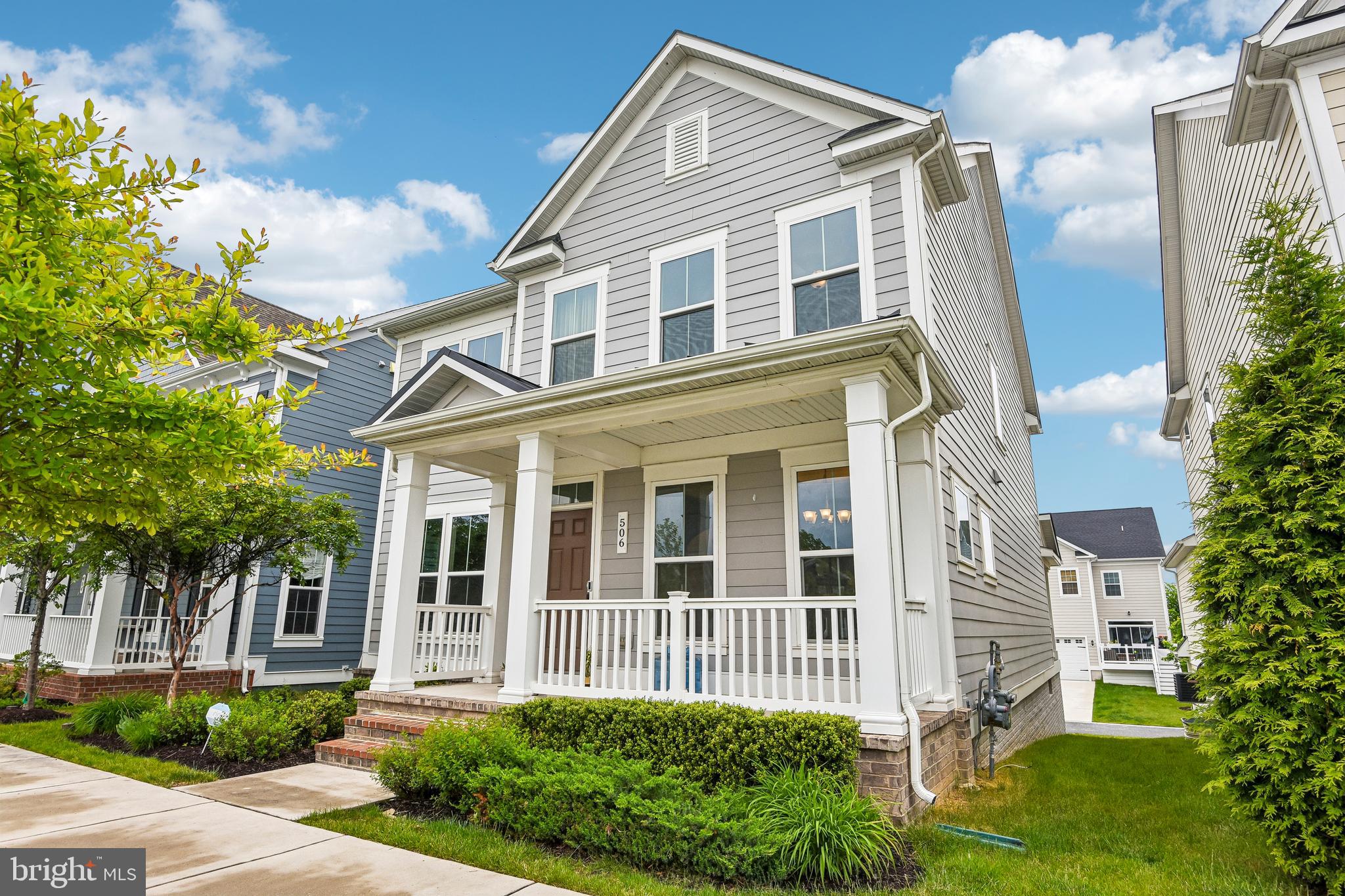 Located in the heart of Greenleigh, a vibrant master-planned community offering a true live-work-play lifestyle, 506 Ladywell Street combines luxury, convenience, and exceptional community amenities in one remarkable package. Residents enjoy nearby neighborhood shops, restaurants, cafés,  trails, parks, a clubhouse, outdoor pool, fitness center, dog park, and community gathering spaces just moments from their front door. Inside, comfortable everyday living blends seamlessly with spaces designed for gathering, entertaining, and hosting guests. The home also features a rear-entry attached two-car garage. Upstairs, you'll find a spacious primary suite complete with a walk-in closet and an en-suite bath featuring dual vanities and a double-headed walk-in shower. A rare and highly desirable feature of the upper level is a second bedroom with its own private full bath and walk-in closet, providing exceptional comfort and privacy for guests, family members, or multigenerational living. Two additional bedrooms share another full bath. A large second-floor laundry room completes the upper level and adds everyday convenience. The gourmet eat-in kitchen is designed for both everyday living and entertaining, offering quartz countertops, a large center island with seating, stainless steel appliances, double wall ovens, a gas cooktop, tile backsplash, under-cabinet lighting, 42-inch cabinetry, and a spacious walk-in pantry. The formal dining room showcases a striking beamed coffered ceiling, while the open-concept living spaces provide seamless flow throughout the main level. The fully finished lower level offers flexible space for a recreation room, home theater, fitness area, office, playroom, or additional entertaining space. Beyond the incredible amenities right outside your door, convenient access to I-95 and I-695 makes it easy to get wherever life takes you while enjoying the benefits of community-centered living at home.