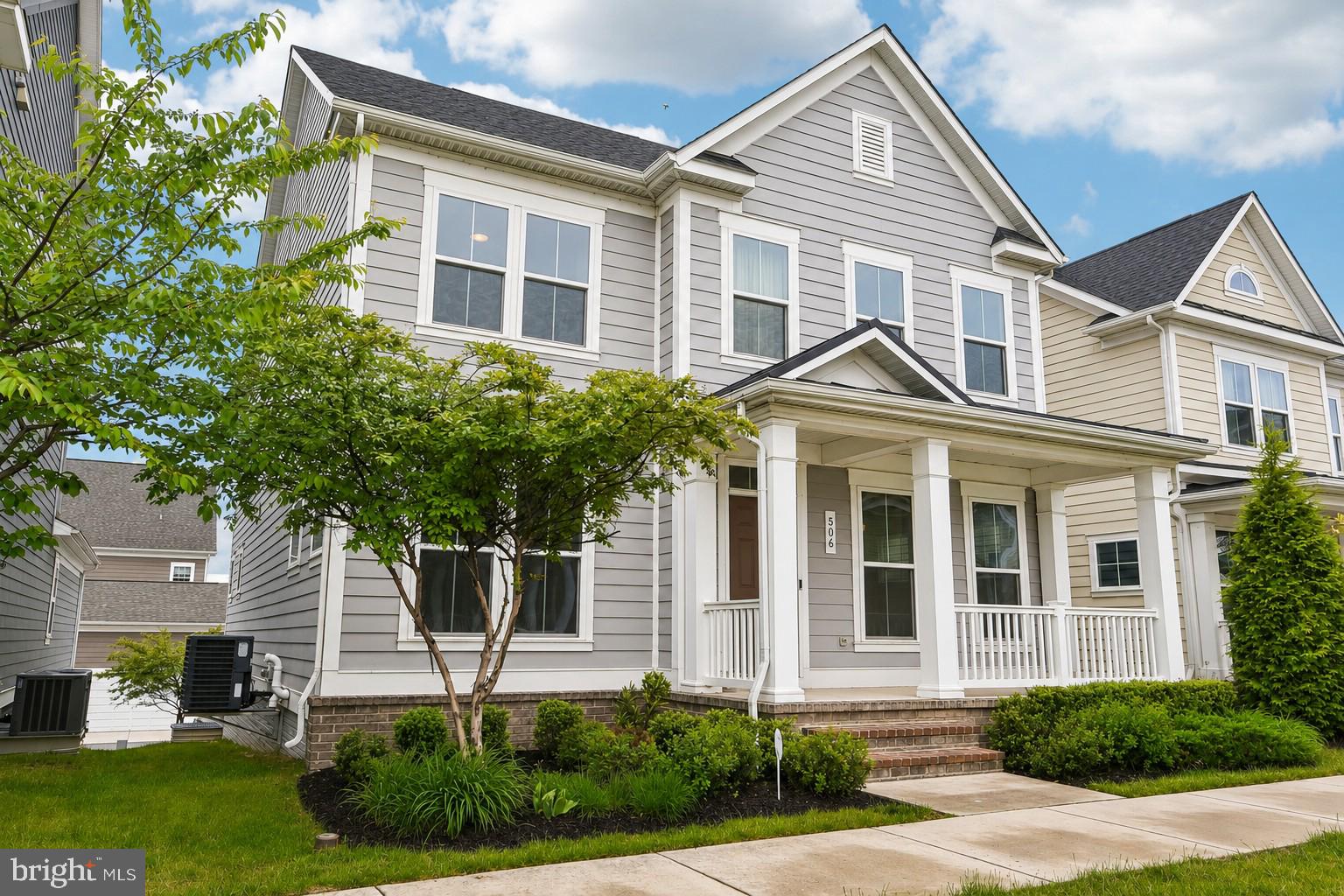 Located in the heart of Greenleigh, a vibrant master-planned community offering a true live-work-play lifestyle, 506 Ladywell Street combines luxury, convenience, and exceptional community amenities in one remarkable package. Residents enjoy nearby neighborhood shops, restaurants, cafés,  trails, parks, a clubhouse, outdoor pool, fitness center, dog park, and community gathering spaces just moments from their front door. Inside, comfortable everyday living blends seamlessly with spaces designed for gathering, entertaining, and hosting guests. The home also features a rear-entry attached two-car garage. Upstairs, you'll find a spacious primary suite complete with a walk-in closet and an en-suite bath featuring dual vanities and a double-headed walk-in shower. A rare and highly desirable feature of the upper level is a second bedroom with its own private full bath and walk-in closet, providing exceptional comfort and privacy for guests, family members, or multigenerational living. Two additional bedrooms share another full bath. A large second-floor laundry room completes the upper level and adds everyday convenience. The gourmet eat-in kitchen is designed for both everyday living and entertaining, offering quartz countertops, a large center island with seating, stainless steel appliances, double wall ovens, a gas cooktop, tile backsplash, under-cabinet lighting, 42-inch cabinetry, and a spacious walk-in pantry. The formal dining room showcases a striking beamed coffered ceiling, while the open-concept living spaces provide seamless flow throughout the main level. The fully finished lower level offers flexible space for a recreation room, home theater, fitness area, office, playroom, or additional entertaining space. Beyond the incredible amenities right outside your door, convenient access to I-95 and I-695 makes it easy to get wherever life takes you while enjoying the benefits of community-centered living at home.