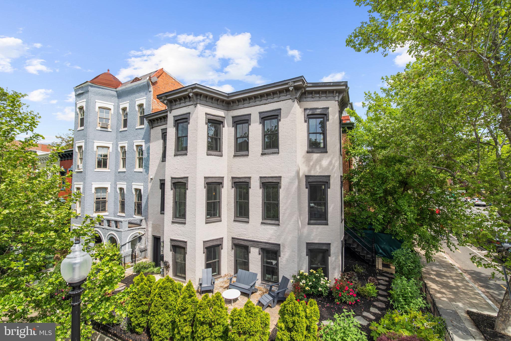 Prominently located between Logan and Dupont circles on a beautiful tree-lined street. This stunning townhome offers two separate units, sold together.  Both homes feature a warm, natural color palette with top-of-the-line appliances and Waterworks bathroom fixtures. Sunlight will warm you in every room. Twenty-seven huge windows offer unique views of nature and city life. Completely restored in 2016 by Kensington, MD builder, JK Build. Enter the main residence as you are overwhelmed by the  natural light, high ceilings, and an open living room and kitchen layout. Three bedrooms, 2.5 bathrooms are in the main home. Upstairs, enjoy one of the best home offices in town. Views in three directions! The master bedroom is just down the hall, connected to a luxurious spa bathroom. The rooftop terrace is perfect for entertaining. Plenty of room for relaxing, and an outside kitchen that includes a refrigerator and built-in grill.The second home offers a private entrance on Q street, Unit #1 is perfect for guest in town, or even a valuable rental unit.  This two bedroom home is also drenched with light shining through nine large windows. All top-of-the-line finishes in the kitchen and bathrooms. Generate rental income or sell in the future. Both units have easy access to a front garden that has been professionally landscaped and maintained. At night the townhome shines. Professional lighting was installed by the current owner to cover the exterior walls with  colorful lighting for pedestrians  to enjoy.   (Square foot totals provided by developer.) Please take a virtual tour using this link - Main Unit (#2) https://my.matterport.com/show/?m=B9ZQkS3hp9e. Second unit (#1) https://my.matterport.com/show/?m=aGYnfGuNrEK