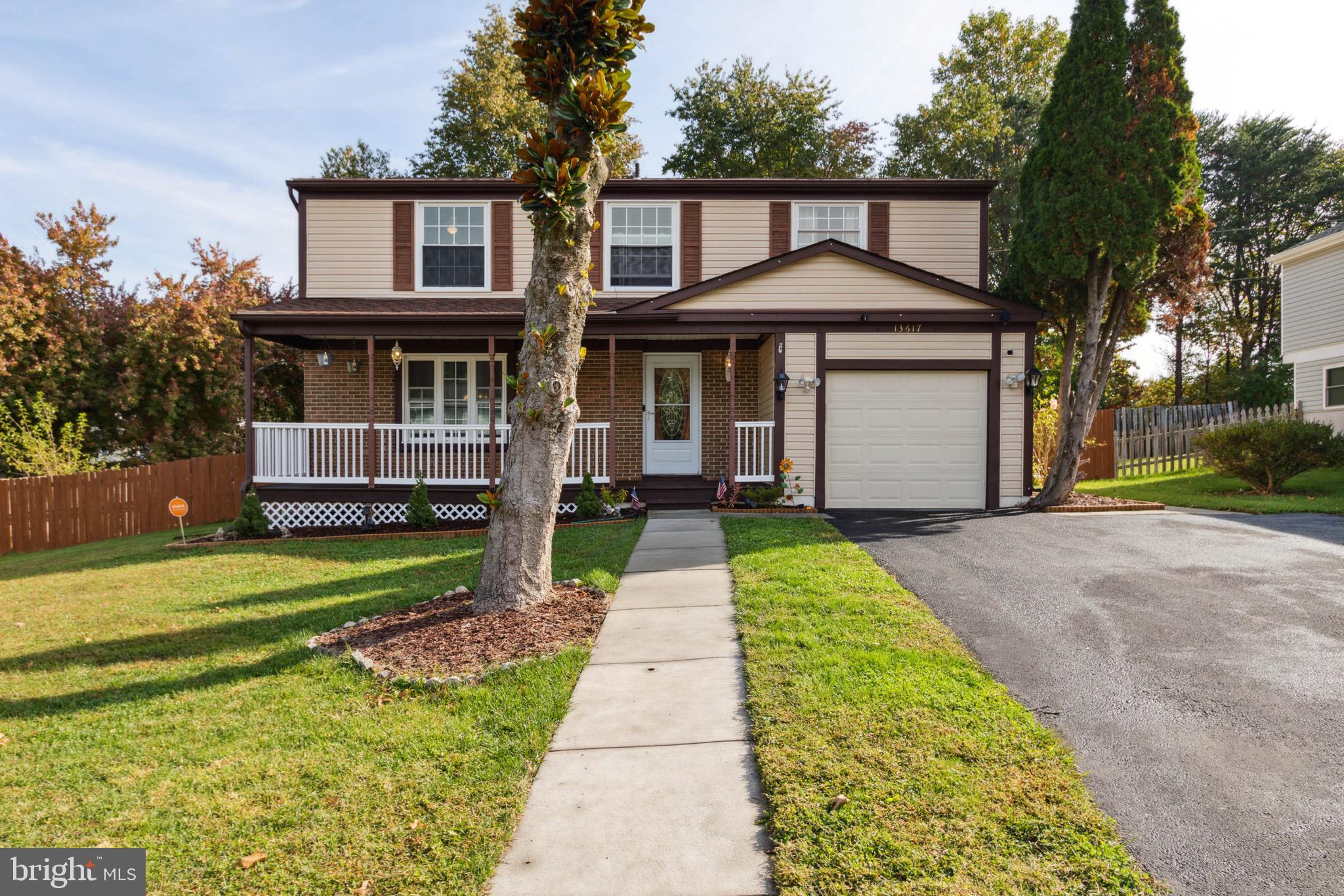 Charming home tucked in the Rollingwood Village Community of Prince William County! This 3-level single family home is an oasis from the busy world.  Boasting over 2,200 sq ft, this home features 4 bedrooms, 2.5 bathrooms, and a 1-car garage with new garage door opener, sealed garage floor and painted walls. 
Inside Features: Hardwood flooring covers the entire main level. The kitchen boasts stainless steel appliances, tiled backsplash, granite counters and a large open pantry.  Formal dining room and living room is great for entertaining guests.  Upstairs the spacious main bedroom has a large walk-in closet, built in vanity and full main bathroom.  Convenient laundry chute from upper level to laundry room in basement. Hallway Bathroom has granite countertop and tiled walls and floor.  Spacious Rec Room in basement and plenty of storage. Laundry Room has large counter for folding clothes with Dryer and newer washer.  Unfinished portion in plumbed for a full bathroom. Newer HVAC unit.  New paint throughout. 
Outside Features: landscaped front yard, extra wide paved driveway (can park 2 cars side by side), welcoming front porch with railing wrapped in vinyl for low maintenance. A fully fenced, flat backyard with an extra-large concrete patio, partly covered by an 18x18 pavilion roof, great for entertaining, brand-new shed to store yard equipment. Community Amenities: Park, Walking Trail, Tennis Courts, Large Playground, Soccer Fields
This home is perfectly located close to I-95 entrance, QUANTICO, FORT BELVOIR & VRE! Close to Potomac Mills, grocery stores, restaurants.