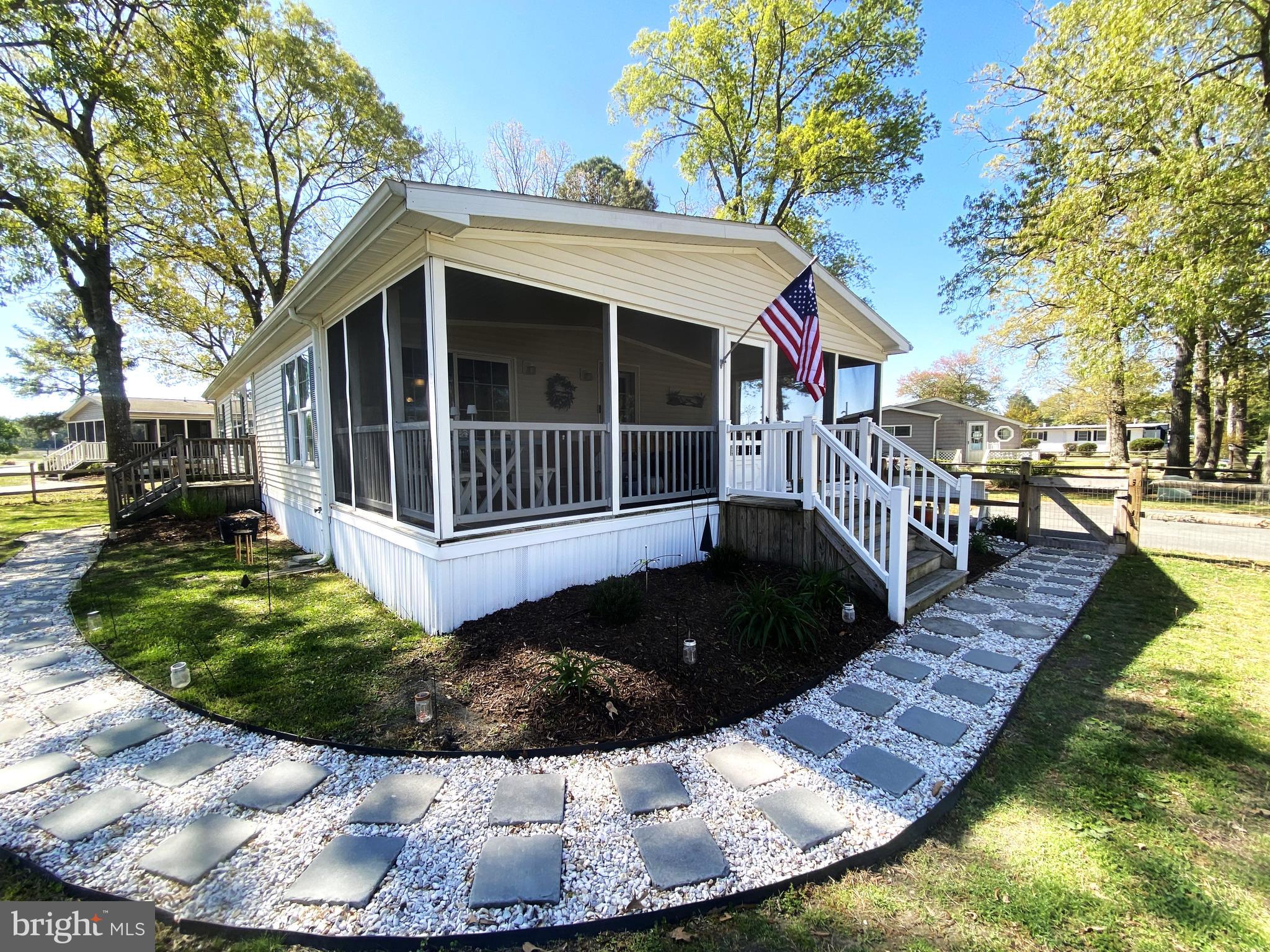 Step into a world of comfort and charm with this delightful 3-bedroom, 2-bath residence, perfectly situated on a spacious corner lot. Spanning an impressive 1320 sq ft, this home is a true sanctuary, surrounded by beautifully manicured gardens and large shade trees that provide a serene backdrop for your everyday life. The fenced yard is not only a safe haven for your furry friends but also a perfect space for outdoor gatherings and playtime.

Enjoy the luxury of a 12x12 shed equipped with power, ideal for storing all your fishing gear and outdoor essentials. With ample parking available for guests, hosting everyone has never been easier. Unwind on your generous large screened in porch, where you can sip your morning coffee or recount your day’s adventures while overlooking the playground and pool. This outdoor space is perfect for relaxation and entertaining. 

Step inside to discover a warm and welcoming kitchen that boasts newer appliances, generous counter space, and an abundance of cabinets. Whether you’re whipping up a family feast or enjoying a quick breakfast, this kitchen makes meal preparation a joy. The centrally located living room is designed for comfort and connection, featuring large windows that flood the space with natural light. It’s the perfect gathering spot for family and friends to create lasting memories.  This home offers bright and airy guest rooms, each equipped with large closets to accommodate all your storage needs. The luxurious primary suite is a true retreat, featuring a spacious walk-in closet and an en-suite bathroom that promises a spa-like experience every day. 

Experience the vibrant lifestyle that Pot-Nets Bayside has to offer! With private beaches, marinas, and a host of community amenities at your fingertips, you’ll never run out of things to do. Plus, enjoy the peace of mind that comes with full-time security, allowing you to fully embrace the coastal living experience. Don’t miss your chance to make this charming residence your own. Embrace the coastal lifestyle at its finest and start creating unforgettable memories in your new dream home today!