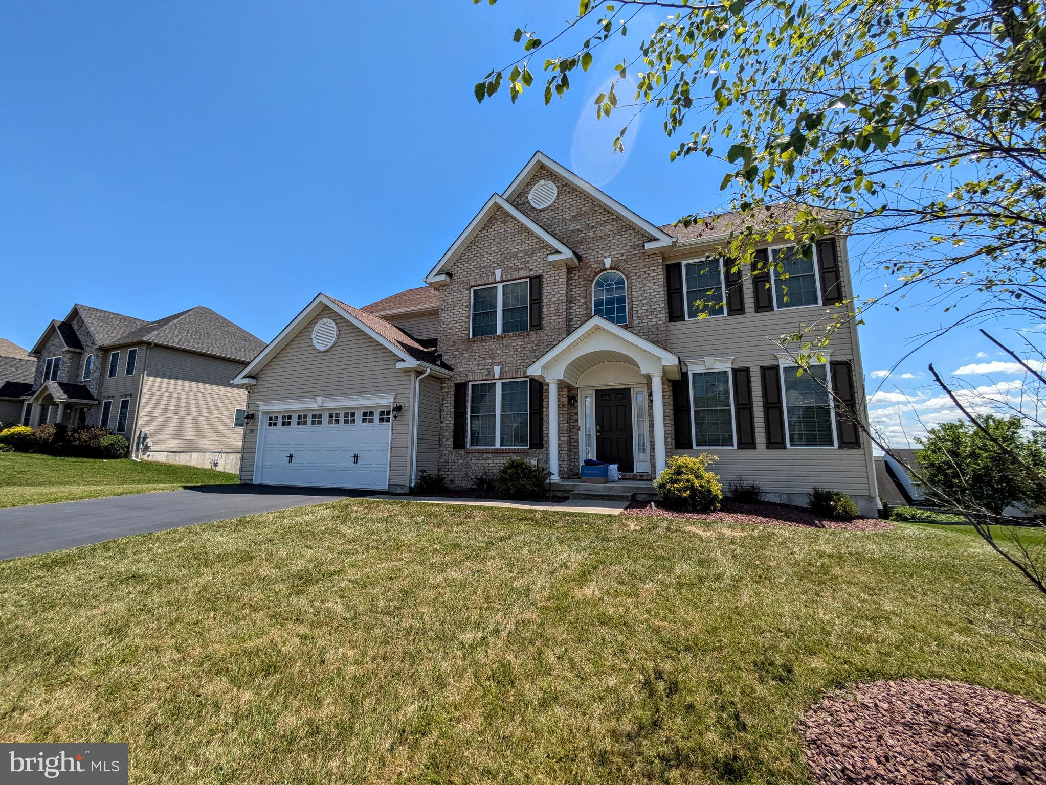 This spacious and bright colonial feels like it was just built. A welcoming 2 story foyer flanked by the living and dining rooms. Rich hardwood floors through most of the first floor and upstairs hall adds some warmth and elegance. The family room has a cathedral ceiling with many windows, gas fireplace and entertainment system area. The kitchen has a center island, tile backsplash, ample granite counter space with 42" cabinets. There is a first floor bedroom flanked by a full bathroom. The 2nd floor contains 4 additional bedrooms including the primary suite. The suite has 2 walk in closets, full bathroom and a wonderful view of the valley. Full daylight basement containing efficient gas heat and water heater. 2 car garage that leads into the home through the 1st floor laundry/mud room. Other touches are wrought iron balusters on the steps and hall that looks onto the family room and foyer. This is a great location in the Nazareth School District and is close to major routes, shopping, entertainment and recreation.