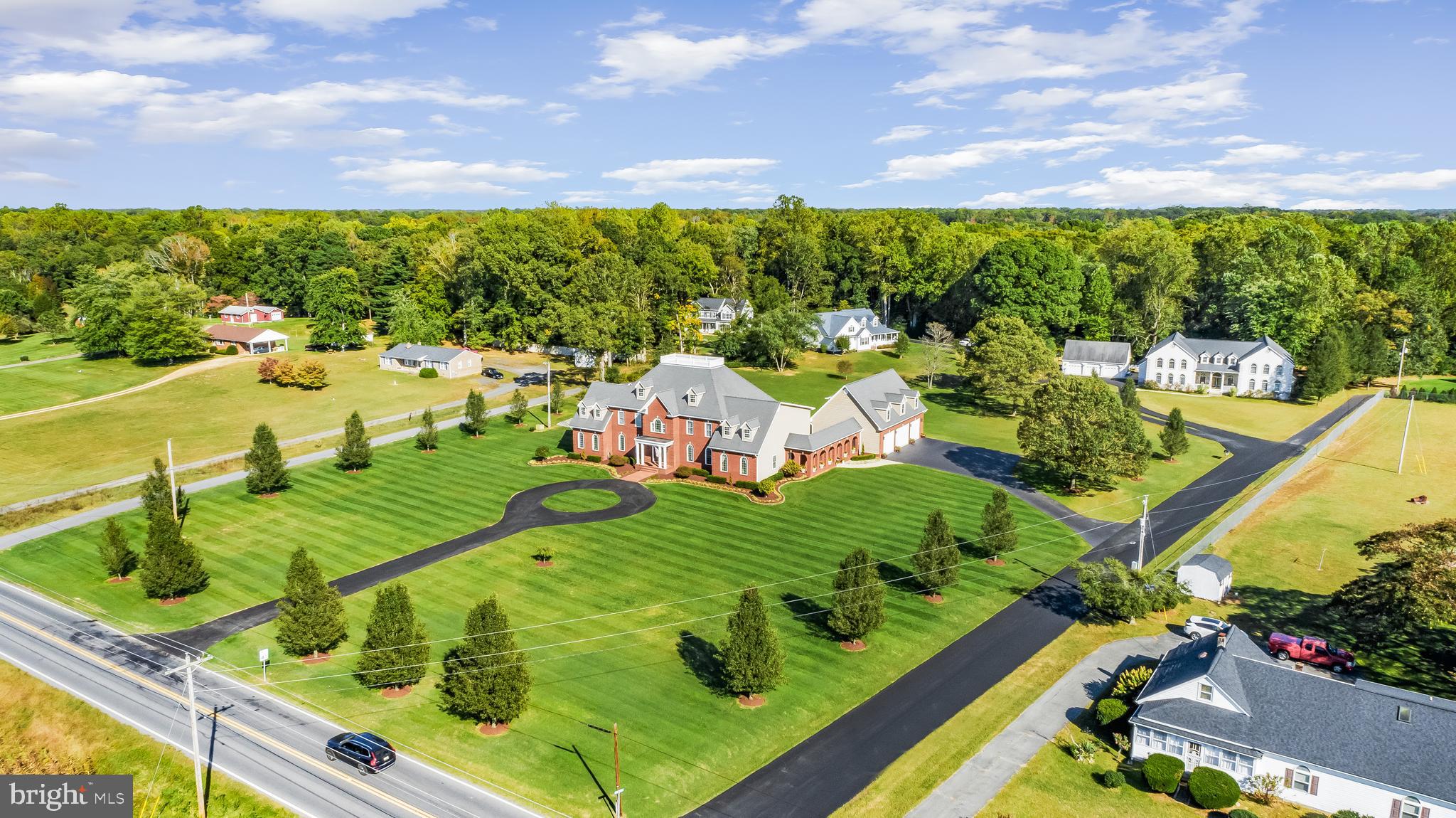 There are no words that can fully describe the level of detail and care in this property.  Intentional elegance, tasteful opulence, thoughtfully efficient are just the surface of what this property has to offer and what it can be for you and or your family.  This home has almost everything you can ask for in an estate.  The property features a total of  10,800 finished sq feet across 7 bedrooms and 6.5 bathrooms.  There is 1,294 sq feet  of this footprint in an apartment that is above the garage.  The tax record is incorrect as the basement and main level are approximately 5300 sq ft each. The total square feet is adjusted and reflected in the coming 3D laser scan.  This puts the main home at 12,442 sq feet and total structure is 13,736 sq feet plus the remaining sq footage of the garage itself. The apartment is currently used as an income generating apartment, but could easily be the guest home or private living space for an older dependent.  Please review the Features & Information sheet in the disclosures for additional information on the property.  Note the photos are of true night, exterior and drone to get a full scope of the lot and property.  The shingled roof was replaced in 2025 with a new black shingle and has a transferable warranty.