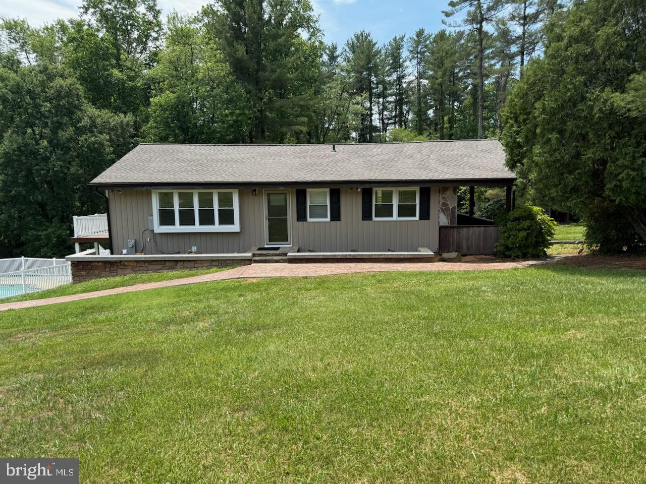 Beautiful home on shared private driveway!!  Multi-unit or use as one dwelling home with lots of updates on partially wooded lot to enjoy the nature, and also a built in swimming pool to provide an amazing place for entertaining.  Upstairs Features a spacious Country kitchen/with dining room space off living room with lots of natural light, Full bathroom, Family Room, and Bedroom.   Downstairs, Bedroom & Laundry Room,  and a private In-Law Apartment with outside access to include fully equip kitchen, dining room, Living Room, Full Bathroom, Bedroom, and Laundry Room. Lots of updates: New vinyl plank flooring in both family and bedroom upstairs and Tile throughout the downstairs.  New roof on both house and garage, and new garage opener.  New hot water heater, water softener system, well pump, HVAC system, Updated Electric to MD code, and many many more updates. Oversized garage with underneath storage.  A Must See!!  Disclosure: Realtor is also owner of property.