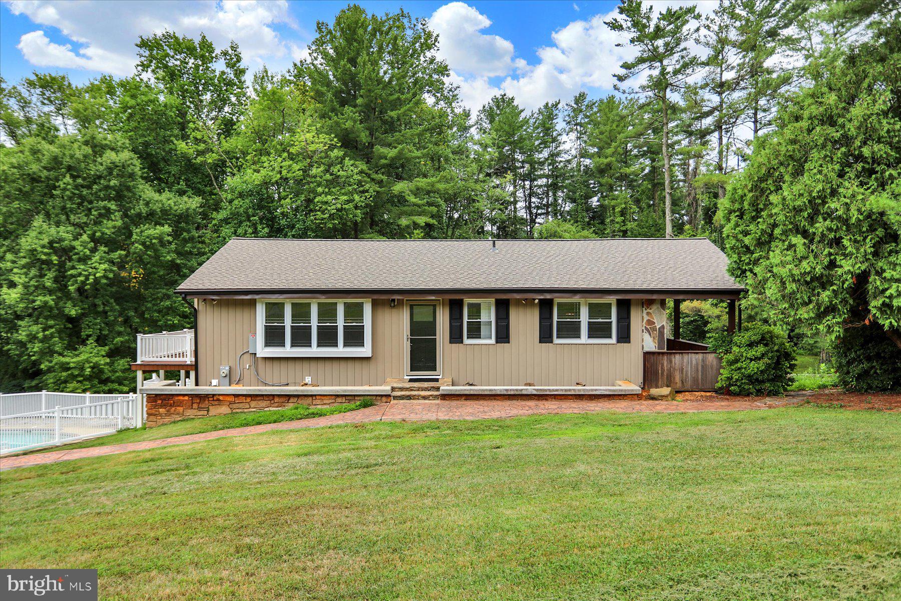 EXCELLENT OPPORTUNITY for Mulit-Family, Contractors, Investors! to own a private oasis!  Beautiful home with in-law apartment on a shared private driveway!!  Multi-unit or use as one dwelling home with lots of updates on partially wooded lot to enjoy the nature, and also a built in swimming pool to provide an amazing place for entertaining.  Upstairs Features a spacious Country kitchen/with dining room space off living room with lots of natural light, Full bathroom, Family Room, and Bedroom.   Downstairs, Bedroom & Laundry Room,  and a private In-Law Apartment with outside access to include fully equip kitchen, dining room, Living Room, Full Bathroom, Bedroom, and Laundry Room. Lots of updates: New vinyl plank flooring in both family and bedroom upstairs and Tile throughout the downstairs.  New roof on both house and garage, and new garage opener.  New hot water heater, water softener system, well pump, HVAC system, Updated Electric to MD code, and many many more updates. Oversized garage with underneath storage.  A Must See!!  Disclosure: Realtor is also owner of property.