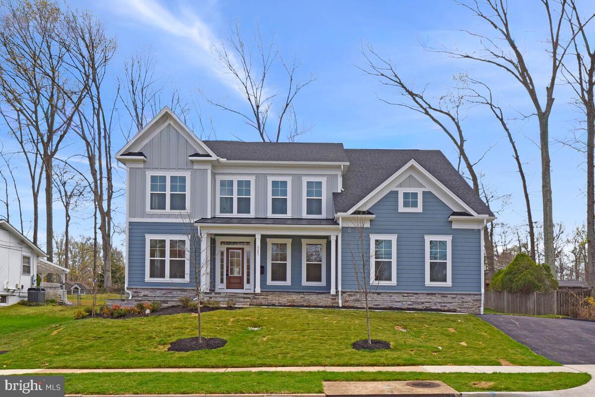 Welcome to this exceptional new construction by Evergreene Homes, featuring the highly sought-after Foxmoor model in the heart of Keene Mill Manor. Located at 8205 Dabney Avenue, this stunning home offers over 5,800 square feet of thoughtfully designed living space across three finished levels, with high-end finishes and custom upgrades throughout. The main level showcases a bright, open-concept layout with wide-plank engineered hardwood flooring, elevated ceilings, and seamless flow ideal for everyday living and entertaining. The family room is anchored by a sleek Mezzo linear fireplace and enhanced with custom ceiling beam detailing. The gourmet kitchen is a true showpiece, featuring upgraded cabinetry, Silestone quartz countertops in Et Calacatta Gold, a large center island, designer tile backsplash, and a full Samsung stainless steel appliance package including gas range, chimney hood, French door refrigerator, wall oven/microwave combo, and dishwasher. A butler’s pantry with additional cabinetry and quartz counters adds both elegance and functionality, while the morning room with vaulted ceiling opens to an extended composite deck, perfect for indoor and outdoor living. The upper level continues with hardwood flooring throughout, including all bedrooms. The luxurious primary suite features a box ceiling and a spa-inspired bath complete with a freestanding soaking tub, frameless glass shower, rainfall shower head, handheld spray, and upgraded designer fixtures. Quartz countertops, tile-to-ceiling surrounds, and custom cabinetry elevate every bath. Secondary bedrooms are generously sized with beautifully finished en-suite baths. The fully finished walk-up basement offers exceptional versatility, including a spacious recreation area, media room, exercise room, additional bedroom, and full bath. A wet bar rough-in provides future potential, while the walk-up areaway brings in natural light and easy outdoor access. This home is loaded with upgrades, including hardwood flooring on main and upper levels, quartz countertops throughout, upgraded cabinetry, designer tile packages, frameless shower doors, recessed lighting, ceiling fan prewires, wood shelving, structured wiring, humidifier, electronic air cleaner, and gas rough-in for an outdoor grill. The exterior features cement siding with stone accents, architectural shingles, a standing seam metal roof detail, a 2-car side-load garage, and spacious backyard. The extended deck and walk-up basement create the perfect balance of functionality and outdoor living. Located within the highly desirable Keene Mill, Irving, and West Springfield High School pyramid, this home offers access to top-rated schools, strong community appeal, and long-term value. A rare opportunity to own a fully upgraded, move-in ready luxury home in an established neighborhood with no HOA, just minutes to parks, shopping, dining, and major commuter routes including metro bus, rail and VRE. Welcome home! *This home is virtually staged.