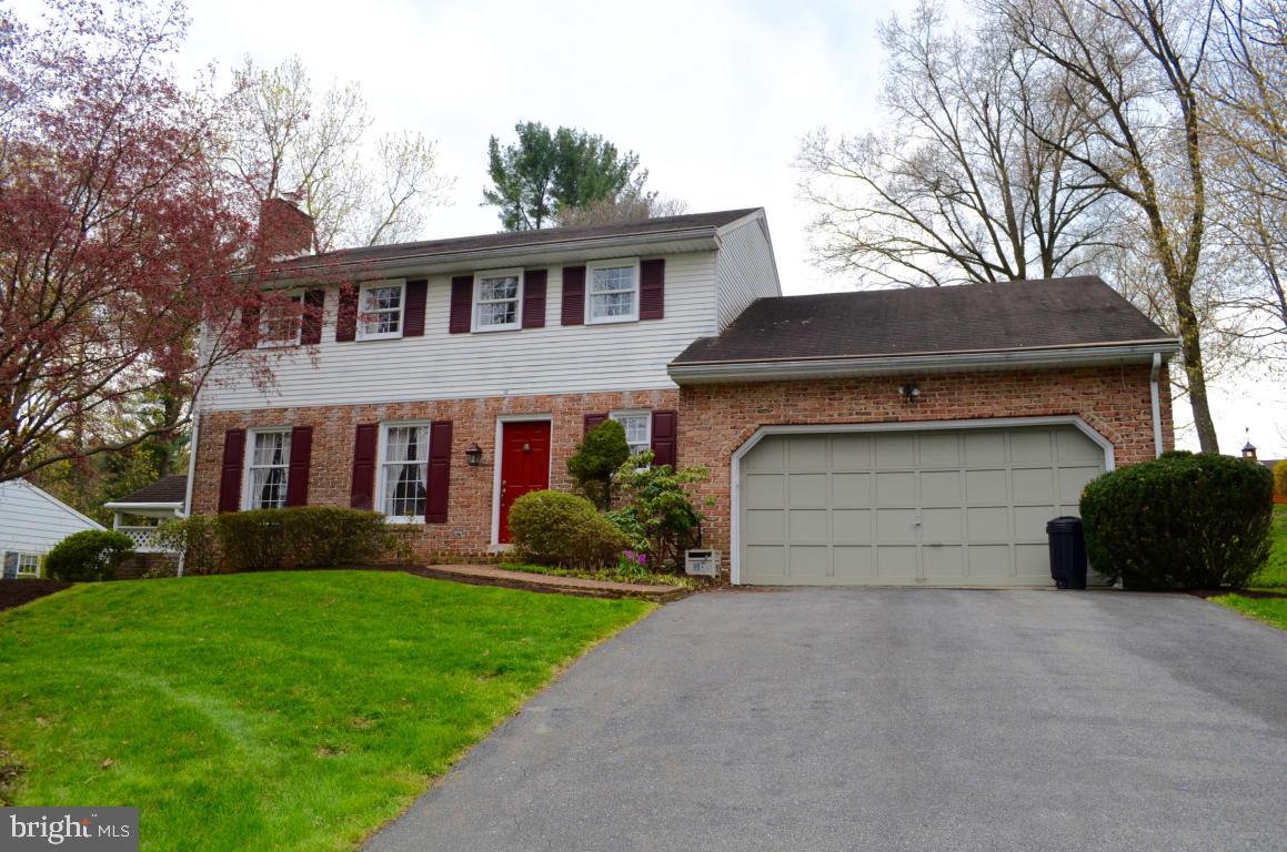 Bring your personal touches to this pleasant Colonial Style home in a charming neighborhood! Brick & Vinyl exterior that is perfectly landscaped on nearly 3/4 acre lot. Inside you'll find 4 generous BR's plus 2-full & 1-half baths, crown molding & chair rail throughout, and a nice Cook's kitchen with Breakfast Bar. Also is a large Family Room with brick fireplace, and formal Living & Dining Rooms. It is affordably priced & ready for a new owner!