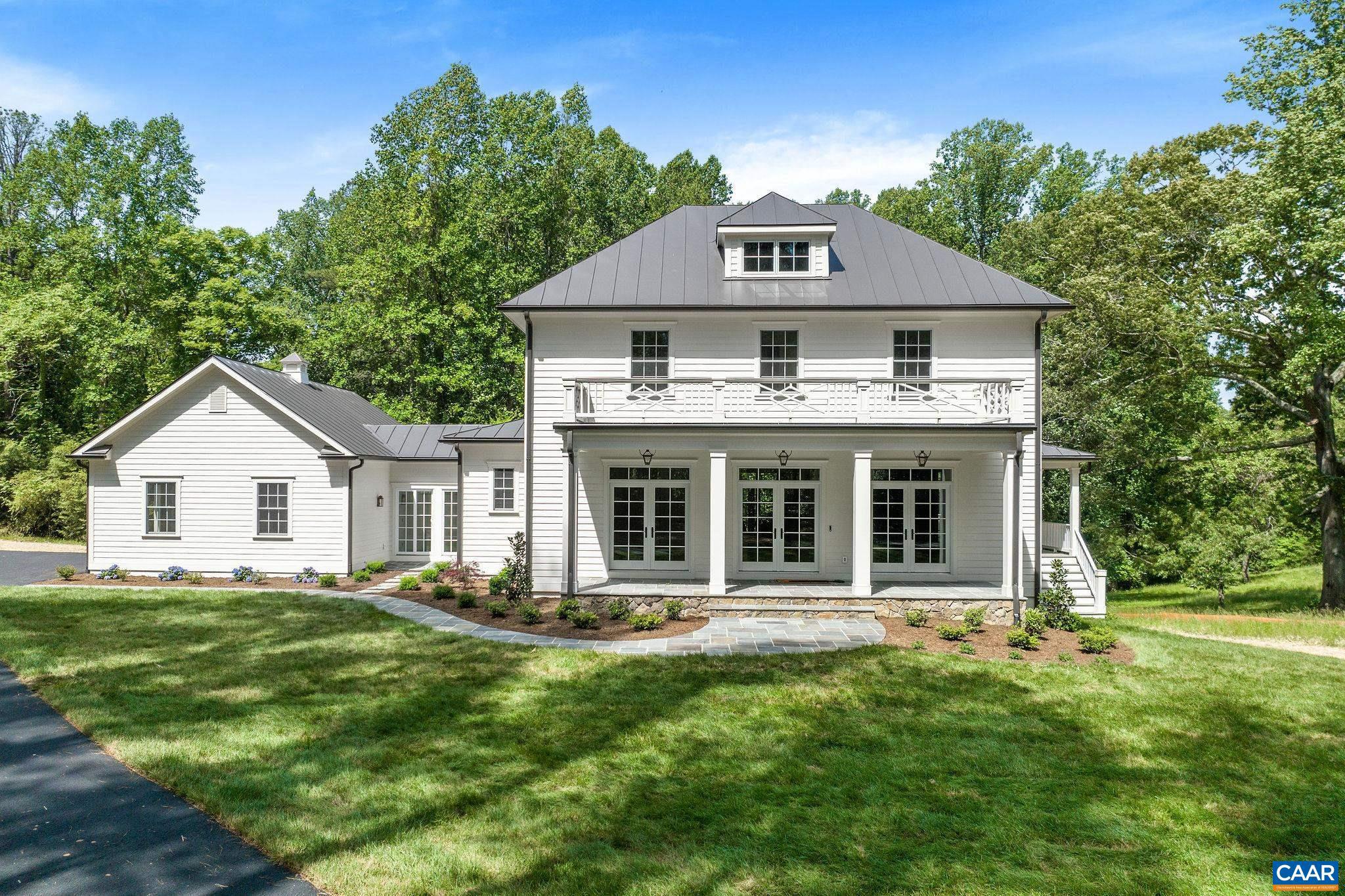 TO BE BUILT 5 BR custom home in one of Albemarle County?s most coveted locations. Just off Garth Road, down a privately-accessed deeded driveway lined with black board fencing, lies this rare 3+ acre homesite. The proposed home design features a timeless architecture with a smart, livable floor plan set behind a gracious covered porch with metal roof and clean, classic lines. Designed for everyday living and effortless entertaining, the main level centers on an open kitchen and gathering space that flows beautifully to outdoor living. A first-floor guest suite provides flex space, while the library shares a bar area with the great room for entertaining. Upstairs, the home offers a private primary suite with a generous bath and closet layout, plus two additional bedrooms. A 5th BR/bath in the finished terrace level. All thoughtfully planned for today?s living with generous gathering spaces and the flexibility to tailor finishes and details. Set among estates and neighboring horse farms, this property offers exceptional peace, privacy, and quiet, while remaining 5 miles to everything Charlottesville & UVA has to offer. A rare opportunity to build your custom home in a prime setting in Ivy Elem/Murray/Western Albemarle schools.,Painted Cabinets,Quartz Counter,Wood Cabinets,Fireplace in Great Room