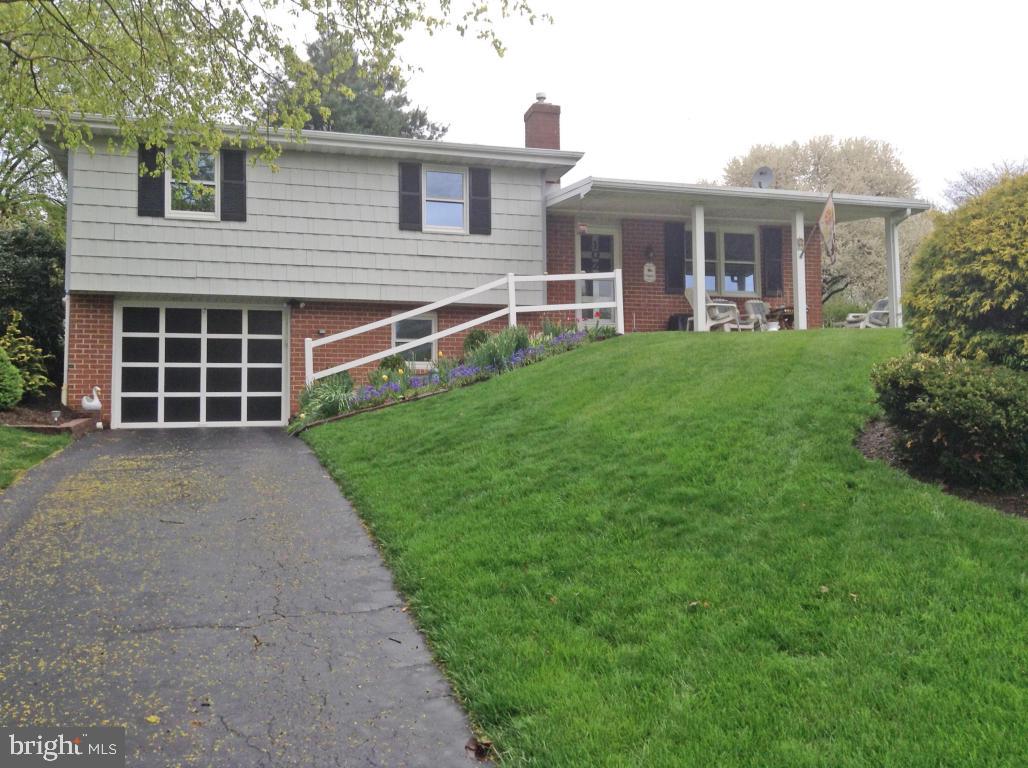 Very well kept, one owner home in a quiet country development. Some recent upgrades include new windows and paint, efficient heating system, and on demand hot water system too. Large 1/3-acre lot provides privacy and room for gardens & relaxing; large deck for entertaining and a front porch to watch the days go by.  Lower level features include room for a den with gas log fireplace, powder room &