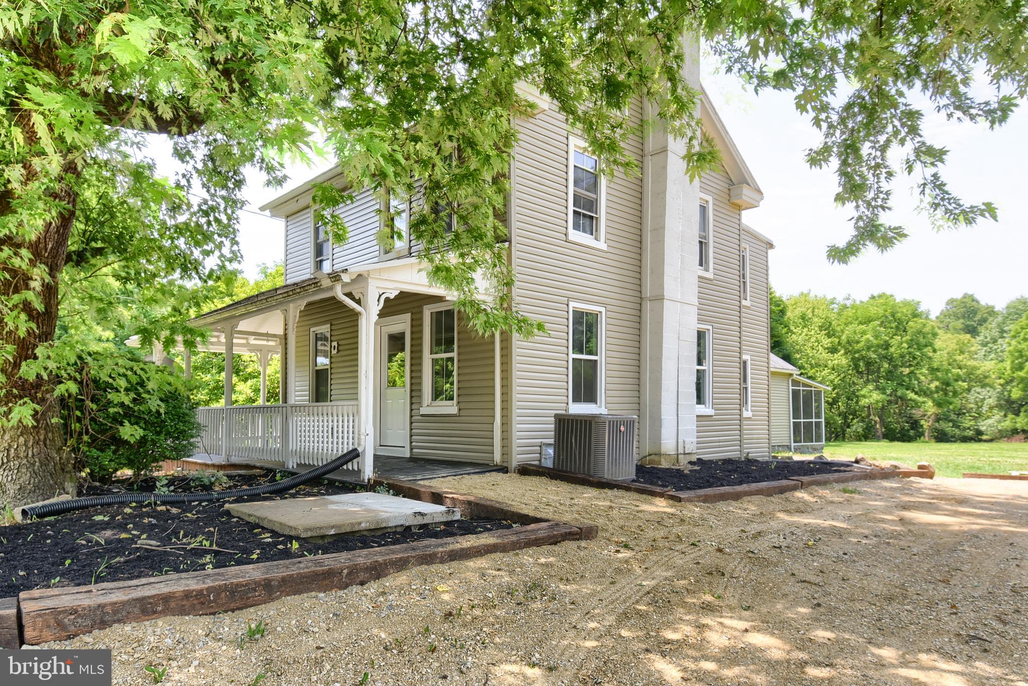 Step into the perfect blend of timeless charm and modern comfort in this beautifully restored historic farmhouse nestled on approximately 1.25 scenic acres in the highly desirable Northern York School District. Every inch of this home has been thoughtfully renovated while preserving the character and warmth that make older homes so special. The stunning new kitchen is the heart of the home, featuring granite countertops, a large center island, stainless steel appliances, pantry, and an inviting feel that's perfect for everyday living and entertaining. The spacious living room showcases beautiful hardwood floors, while the impressive family room offers soaring vaulted ceilings, hardwood flooring, and abundant natural light. The flexible floor plan includes a convenient main-level laundry room and a full bath on the first floor. Relax with your morning coffee on the classic wrap-a-round front and side porches or unwind in the screened rear porch overlooking the peaceful backyard. Outside, you'll find approximately 1.25 acres of usable land, a massive detached shed for storage or workshop space, and an oversized parking area with room for numerous vehicles, guests, boats, RVs, or trailers. Major system upgrades provide peace of mind for years to come, including a restored & painted metal roof, newer heat pump, new water heater, new well pump, new pressure tank, new water softener, and UV water treatment system. If you've been searching for a home that offers the character and craftsmanship of a bygone era without sacrificing today's modern conveniences, this exceptional Dillsburg property is truly one of a kind.