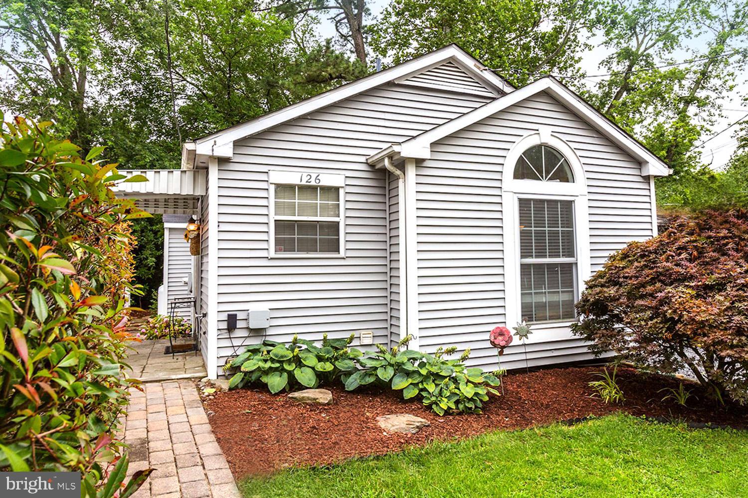 Water privileges for under $260,000.00 in Riva!! Cozy and updated, this cottage is perfect for a first home or someone looking to downsize to easier maintenance and slower living. The Sylvan Shores community has a sandy beach, boat ramp, fishing pier, playground, and kayak racks.  New roof, new skylights, new appliances, full house alarm system and surge protector. Bring your offer - this bargain won't last long!