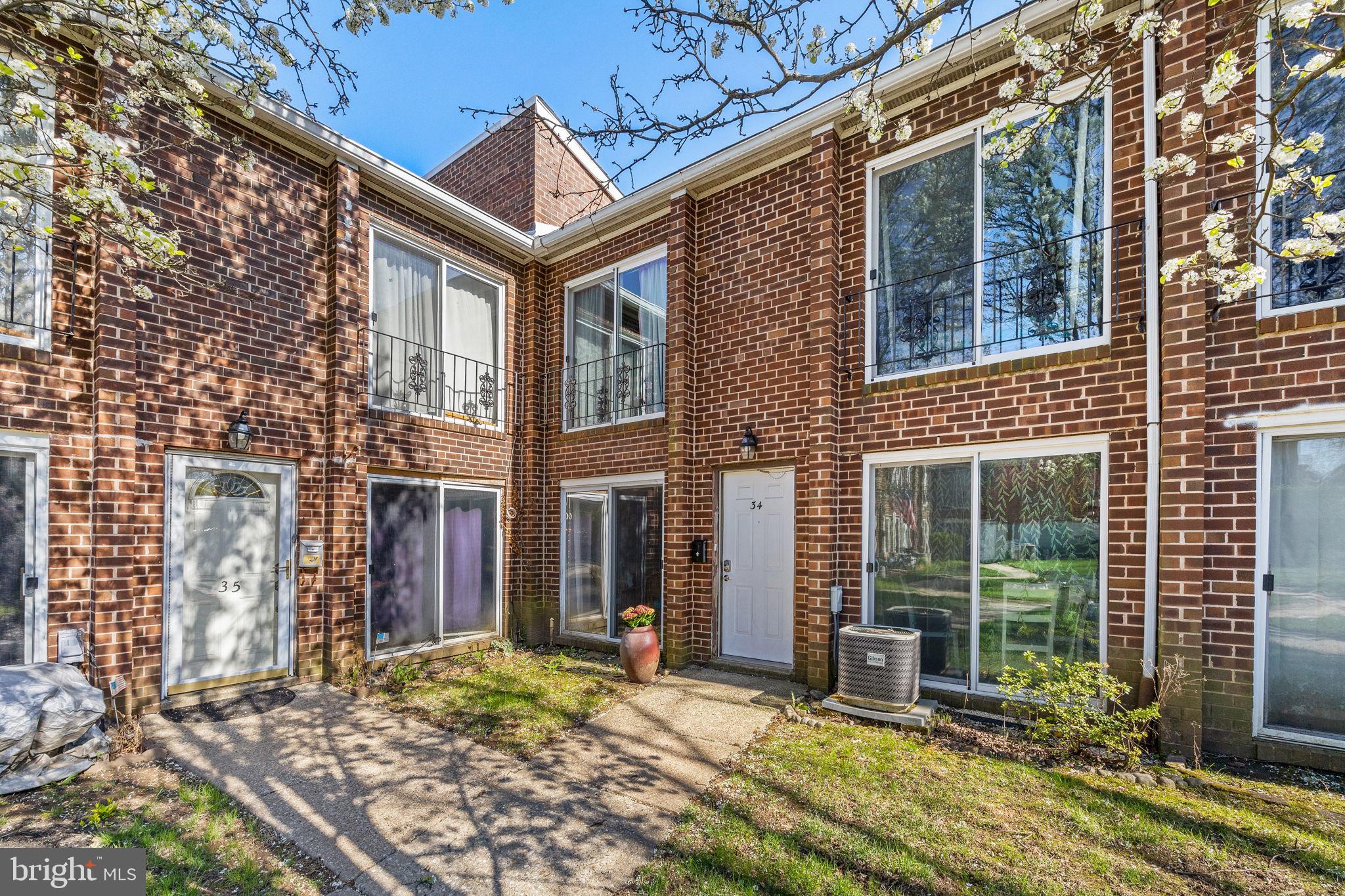 Welcome to #34 at 9001 Ridge Avenue – a recently renovated two-story brick townhome offering the perfect blend of style, comfort, and convenience. This 2-bedroom, 1.5-bath home features thoughtful upgrades throughout.  Step inside to a spacious and sunlit living area that flows seamlessly into a beautifully updated kitchen and dining space. The kitchen is equipped with sleek stainless steel appliances and contemporary cabinetry.  A convenient half bath with an in-unit washer and electric dryer rounds out the first floor.  Upstairs, you'll find two generously sized bedrooms, each with ample closet space and brand-new sliding glass doors that add style and functionality. The fully renovated full bathroom includes a tub/shower combo, stylish tile surround, and a high-tech Bluetooth vent fan for added comfort and ambiance.  Enjoy maintenance-free living with an HOA that covers gas, water, sewer, trash, landscaping, and snow removal—everything you need for easy, stress-free homeownership. Parking is available in the rear lot, with additional on-street parking for guests.  The ideal Andorra location offers walkability to public transit, shopping, and the scenic Wissahickon Trails—perfect for outdoor enthusiasts. Whether you're a first-time buyer, looking to downsize, or simply searching for a turnkey home, this one checks all the boxes.
