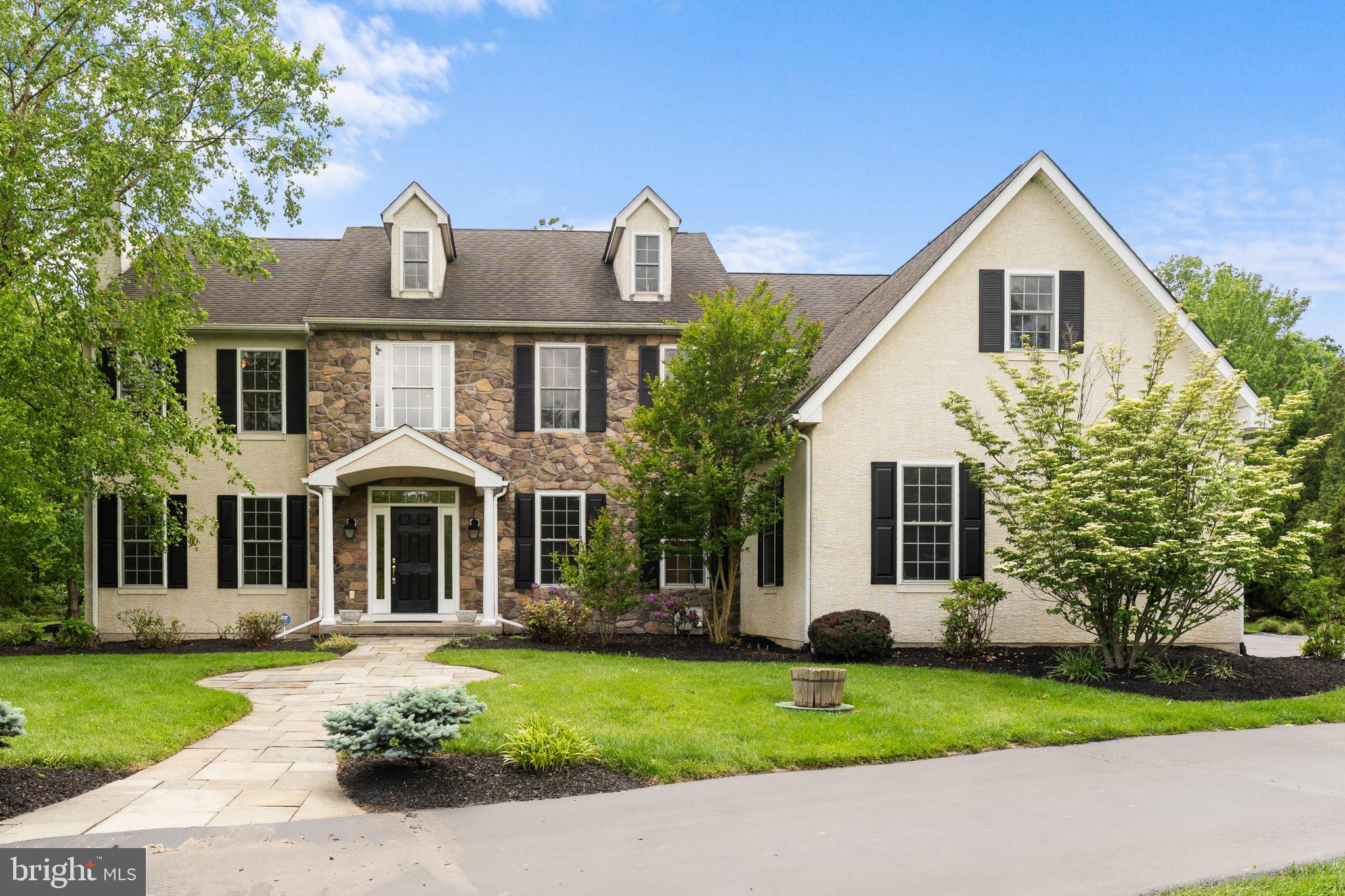 Welcome to 24 Wildwood Drive – A Rare Willistown Gem Available Immediately! Situated at the end of a quiet cul-de-sac in the heart of Willistown, this beautifully maintained home sits on a level and private 2.1-acre lot within the award-winning Great Valley School District. You are welcomed by the classic stone and stucco façade with charming shutters. Step inside to a stunning two-story foyer where gleaming hardwood floors flow throughout much of the main level. To the left, the formal living room invites you to unwind by the wood-burning fireplace, while to the right, the dining room features crown molding and chair rail accents—perfect for hosting special gatherings. The heart of the home is the spacious kitchen and great room. The kitchen is thoughtfully designed with granite countertops, a center island with breakfast bar, stainless steel appliances, and plenty of storage. The adjoining breakfast room opens to a beautiful paver patio and expansive, flat backyard—ideal for entertaining or simply enjoying the serene, wooded surroundings. The great room features a soaring vaulted ceiling and a cozy propane fireplace, making it a warm and inviting space for everyday living. A private home office, half bathroom, and well-appointed mudroom with slate tile flooring, built-ins, and access to the attached garage complete the main level. Upstairs, the primary suite is a true retreat with a tray ceiling, an expansive walk-in closet with custom organizers, and an en suite bath featuring a walk-in tiled shower, free-standing soaking tub, private water closet, and dual vanities. Bedrooms 2 and 3 share a convenient Jack & Jill bath, while bedroom 4 is served by a separate full hall bathroom. The upper-level laundry room adds everyday ease with built-in cabinetry and a laundry sink. The finished lower level provides flexible space for a home gym, recreation area, or media room—and includes a temperature-controlled wine room for the enthusiast. You'll also find ample unfinished storage and a convenient half bath. Ideally located just minutes from Malvern Borough’s charming shops and restaurants, with easy access to major routes and the Paoli Train Station, 24 Wildwood Drive offers the perfect blend of privacy, comfort, and convenience. The  Don’t miss this move-in-ready home with a generator for peace of mind in one of the area’s most sought-after locations—schedule your private tour today! Stucco report is available.