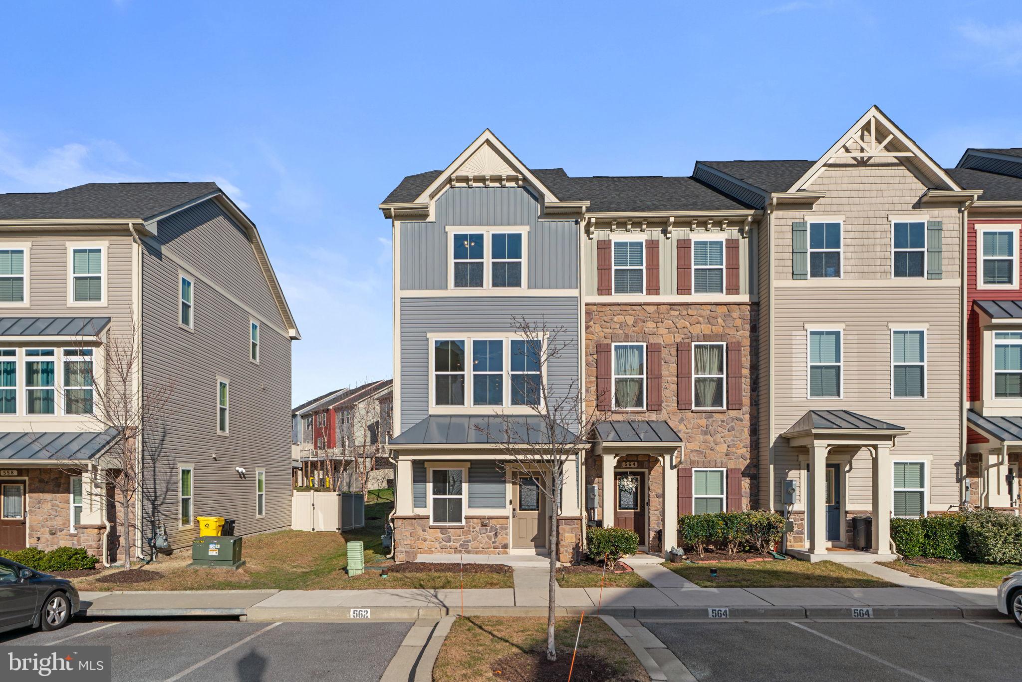 Don’t miss this one! Welcome to this beautiful, like-new end-of-group townhome, built by NVR in 2019 and maintained in true move-in condition, located in the highly sought-after Tanyard Cove / Creekside Village community of Glen Burnie.

This exceptional home offers the perfect blend of style, space, and low-maintenance living. Enjoy all the neighborhood amenities, including a resort-style pool, playgrounds, clubhouse, and workout areas, creating a vibrant and active community lifestyle.

Inside, the layout is both functional and inviting. The lower level features a large, private living area and a first-level bedroom with an ensuite bath, ideal for guests, multigenerational living, or a private home office. Step outside to a charming patio enclave and a fully fenced, maintenance-free backyard with 6’ PVC fencing and artificial turf—perfect for relaxing or entertaining without the upkeep.

The wide-open mid-level is the heart of the home, showcasing a clean, bright, modern kitchen with a large island, abundant cabinetry, and elegant granite countertops—perfect for entertaining friends, hosting family gatherings, or enjoying a quiet home-cooked meal. Just off this level, unwind on the spacious, maintenance-free deck, ideal for morning coffee or evening relaxation.

Upstairs, you’ll find two generously sized bedrooms, each with its own ensuite bath and excellent closet space, providing comfort and privacy for family members or out-of-town guests.

This home truly feels as new as it gets—without the new construction price tag. Opportunities like this don’t last long. Schedule your showing today before someone else gets it!