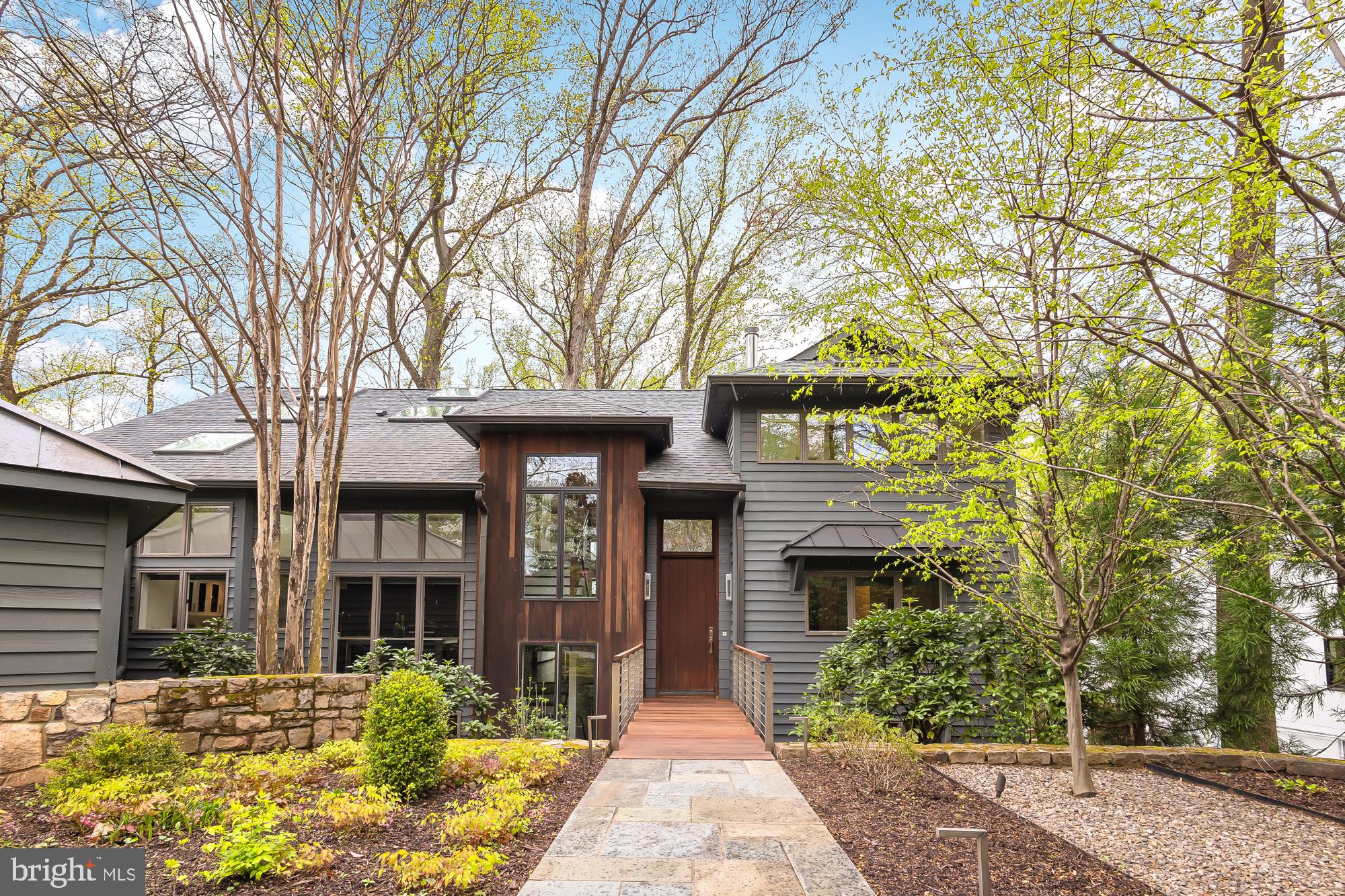 PRICE IMPROVEMENT 
Welcome to your contemporary retreat in the heart of Franklin Park, where luxury meets functionality in this meticulously designed home. Boasting an attached two-bedroom + a den apartment, a sprawling two separate two-car garages, and an array of modern amenities, this residence is sure to exceed your expectations.

Step inside the main house and discover a world of elegance and comfort.  The entire home is flooded with light from the floor to ceiling windows. There are multiple vantage points to take in the natural beauty of the backyard.  

Enjoy meals in the dining room, surrounded by floor-to-ceiling windows that frame the tranquil backyard.  The den, with its pocket doors and full bathroom, offers versatility and privacy, while the open kitchen beckons with Plain and Fancy cabinetry, quartz countertops and high-end appliances from Viking, Miele, and Thermador, and a spacious pantry. There is space at the island to eat or for more formal affairs the dining room has the best view.  With two dishwashers and double sinks in the kitchen, entertaining is a breeze. 

The upper level features four bedrooms, including an inviting owner's suite that offers panoramic views of the nearly one-acre wooded lot. Relax and unwind in the spa-like owner's bathroom, complete with a separate shower, soaking tub, and built-in shelving in the walk-in closet.

Two  of the four bedrooms on the upper level feature charming lofts, providing the perfect space for relaxation and contemplation amidst the beauty of nature. Floor-to-ceiling windows flood the main level with natural light, offering a seamless connection to the outdoors. The open floor plan is complemented by high ceilings and privacy features, creating a serene atmosphere throughout the family room, which boasts a cozy gas fireplace.

Venture downstairs to the lower level, where endless possibilities await. Here, you'll find an additional bedroom, workout room, game room, recreation area, workshop, full bathroom, and even a dark room for your creative pursuits. Step outside onto the lower level deck or access the second two-car garage, providing ample space for vehicles and storage.

The two-level decks offer plenty of space for outdoor entertaining and relaxation, while the wooded backyard ensures privacy and serenity. This home underwent major renovations in 2013-2014 designed by architect Randall Mars and Thorsen construction.  The kitchen was renovated in 2020. 

For added convenience, the hallway from the two-car garage leads to a separate entrance for the two-bedroom apartment. Complete with its own gourmet kitchen, family room, laundry, and full bathroom, as well as a private deck, this apartment offers both comfort and independence.

Experience the perfect blend of contemporary living and natural beauty in this extraordinary Franklin Park residence. Schedule your private tour today and discover the endless possibilities awaiting you in this stunning home.
