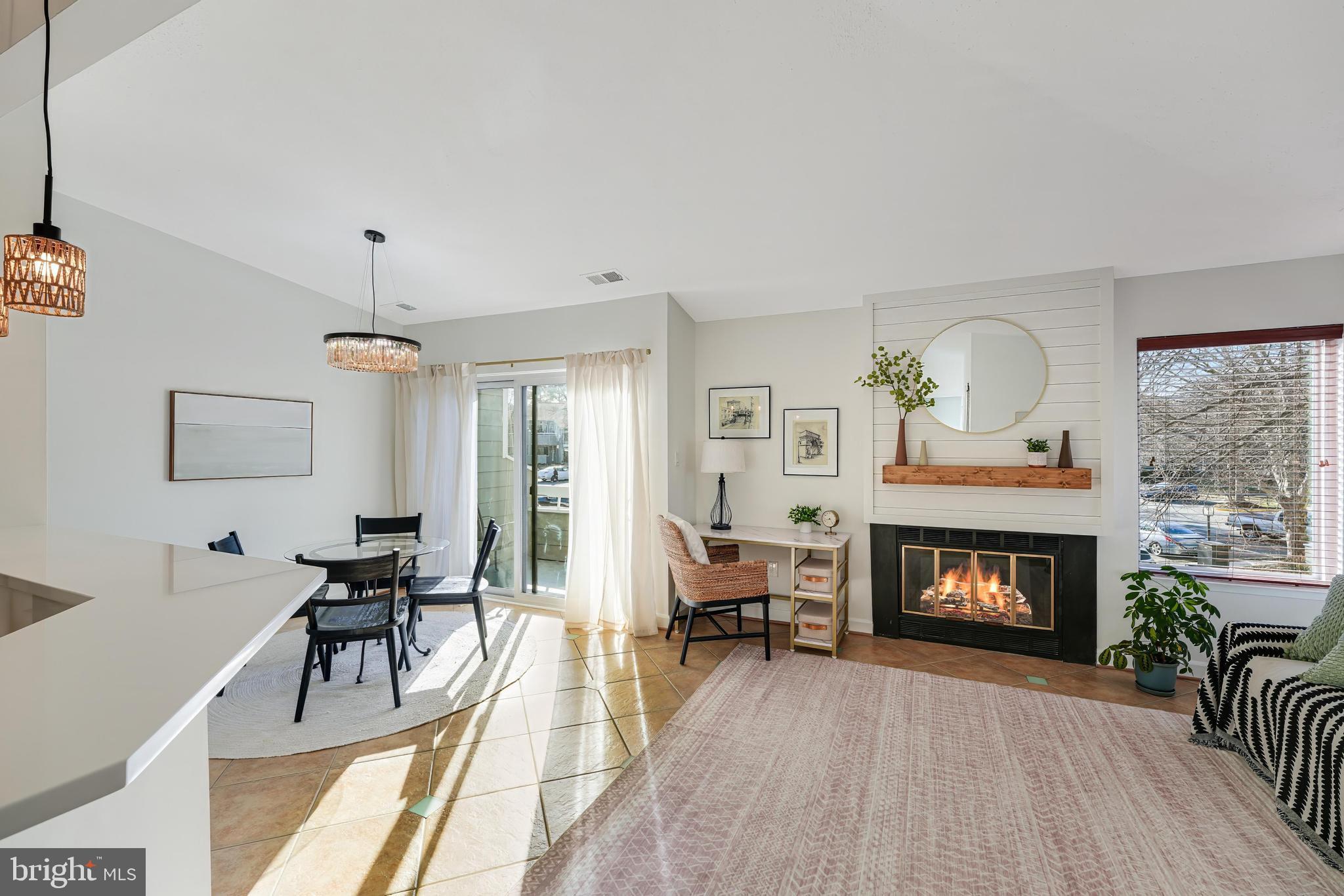 Rare top level balcony unit expertly updated with new kitchen * High ceilings * Corner unit flooded with natural light * Balcony off main level * Fireplace * Updated bathroom * Washer & dryer * Update lighting fixtures throughout * Dining area off living room * Stainless steel appliances * Spacious bedroom with new carpet * Walk-in closet * Newly painted * Amazing location is a short walk to South Lakes Shopping Plaza, Starbucks, Safeway, shopping and dining * Close to Weihle Metro , Dulles Toll Road ands Reston Town Center * Lots of parking * Amazing Reston amenities include multiple pools, trails, parks, lakes, tennis and pickleball courts, and community events, festivities and concerts throughout the year.