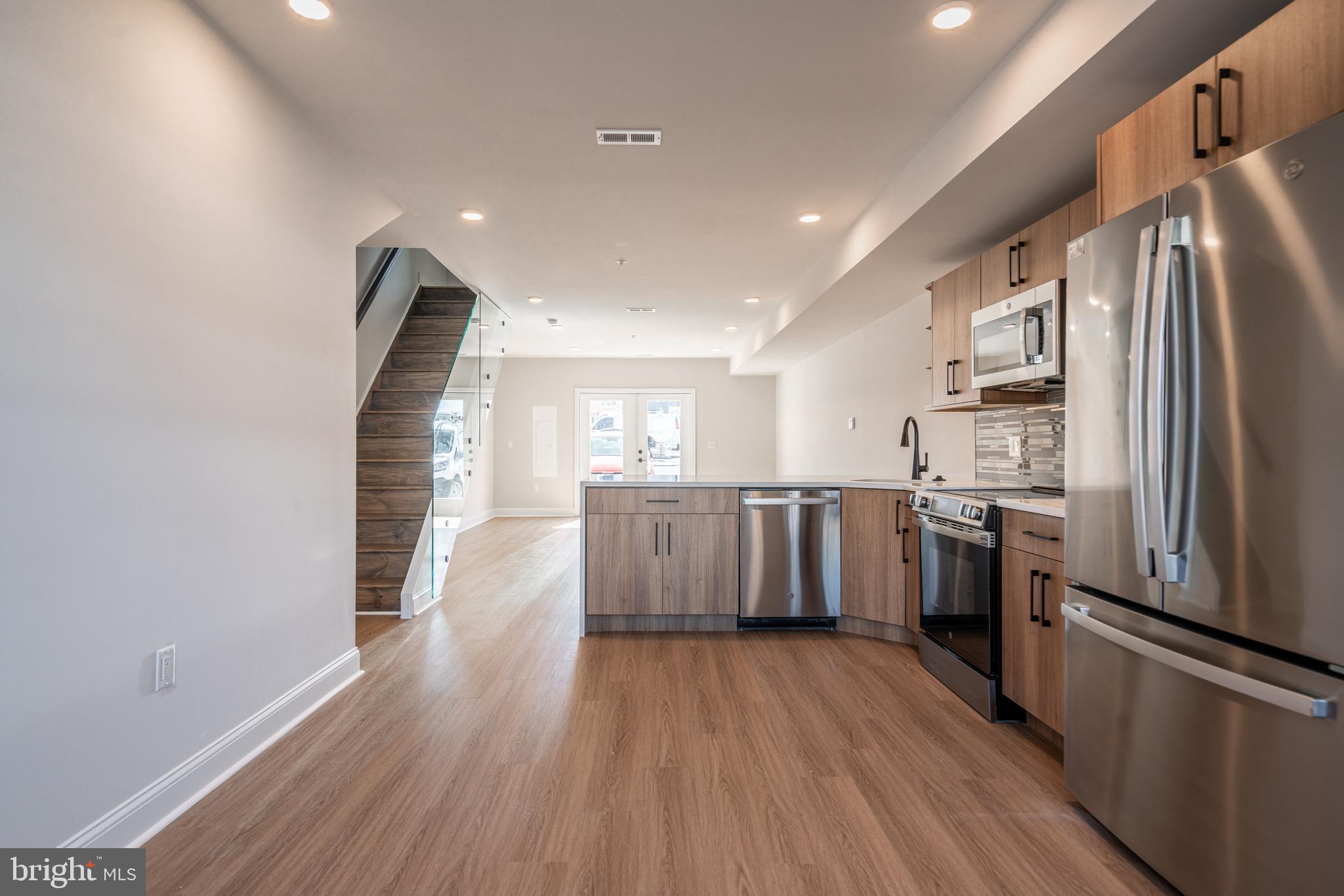 *HOMEBUYER LOAN PROGRAM OFFERING 100% FINANCING, $5,000 LENDER CREDIT AND NO PMI.* 
Welcome to your dream home nestled in the private community of Wynnefield Heights Square. This chic residence boasts 2 spacious bedrooms and 2 modern bathrooms, all enveloped in the comfort of an energy-efficient HVAC system. Step inside to find a meticulously crafted kitchen featuring Quartz countertops with a waterfall edge, Stainless steel appliances, and under-cabinet lighting - bringing warmth and functionality to your cooking space. Natural light floods the space, highlighting the thoughtful details like wood baseboard molding, glass railing, and high end vinyl flooring. The cozy patio off the dining room will serve as serene spot for your morning coffee or evening glass of wine. The chic exterior combines brick and standing seam metal on the mansard roof, enhancing the building's charm and curb appeal. Fully approved 10-year tax abatement promises affordability. Assigned outdoor parking is available for $30,000, ensuring your vehicle's security just steps from your door. Available Summer  2026. Your oasis in Wynnefield Heights Square awaits. 

PHOTOS ARE OF AN IDENTICAL UNIT IN THE DEVELOPMENT.