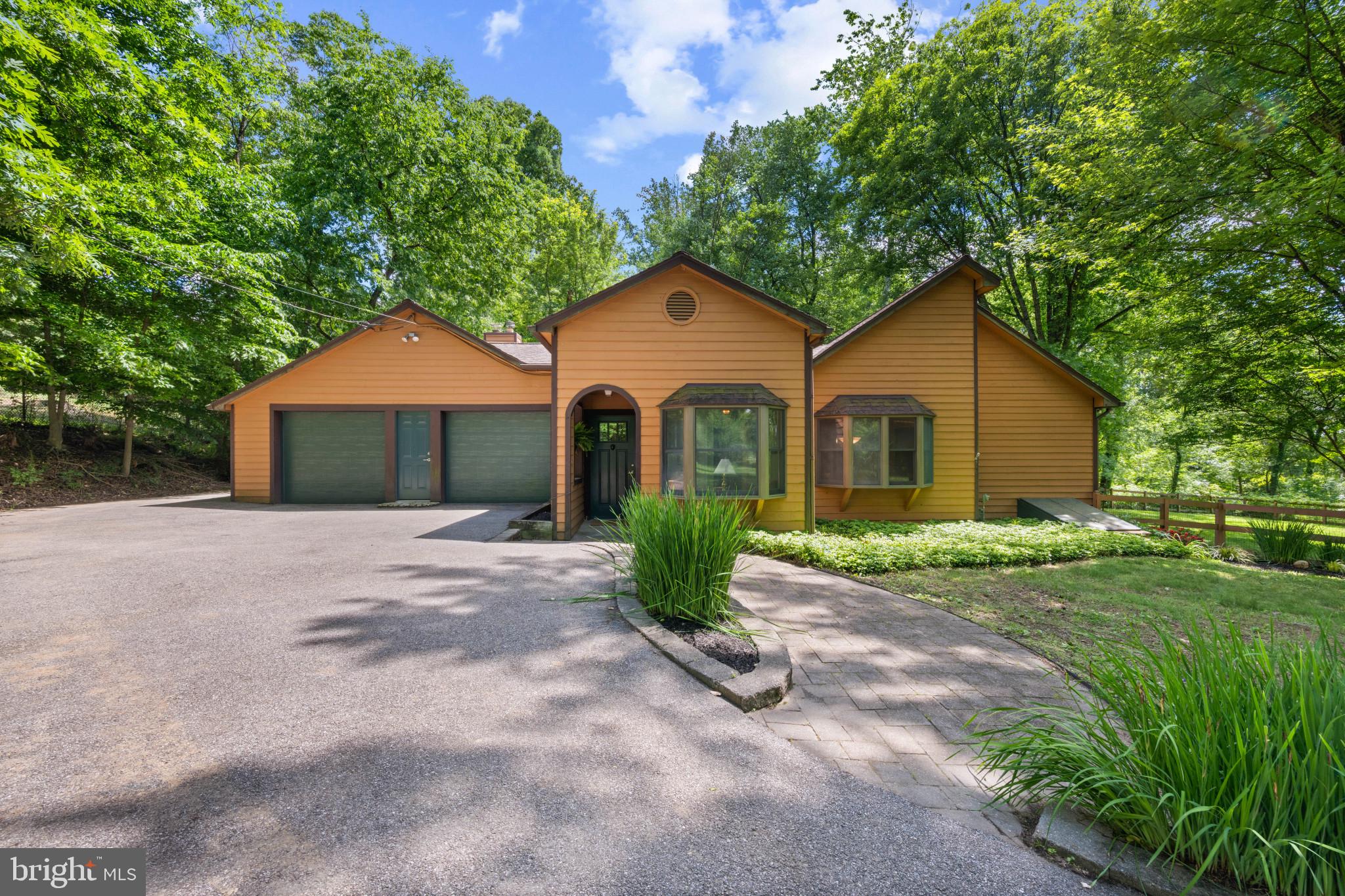 Rare opportunity to own a truly unique property in one of Catonsville’s most sought-after locations! Situated on an incredible 1.4-acre lot with a peaceful, park-like setting, this 3-bedroom, 2 full bath home offers privacy, tranquility, and endless potential. Enjoy morning coffee or quiet evenings from the charming enclosed screened-in front porch, the perfect place to relax and take in the natural surroundings.

Inside, the home is filled with natural light from skylights and solar tubes. Featuring a spacious layout, jacuzzi tub, geothermal heating and cooling, tankless water heater, and a desirable 2-car garage. The home’s charming cedar siding adds warmth and character, blending beautifully with the natural surroundings. This expansive property provides a rare combination of space and serenity while still being conveniently located near shopping, dining, parks, and commuter routes.

Properties with this much land and such a special setting rarely become available in Catonsville. Don’t miss the opportunity to make this one your own!