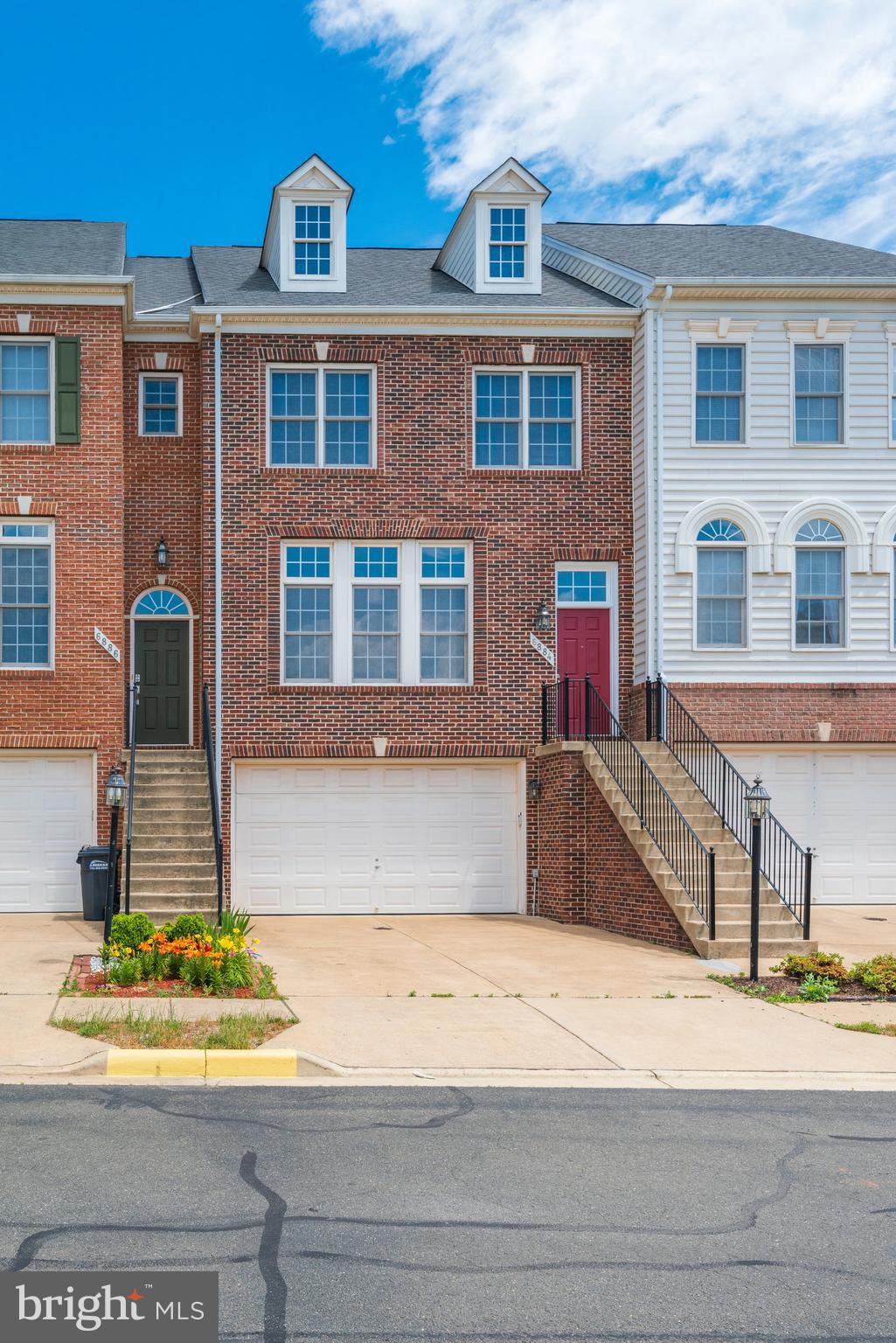 Large Two Car Garage Townhome with Three Level Bump-out and Open Floor Plan. Sun-filled Main Level with Low Maintenance LVP Flooring, Spacious Living and Dining Rooms, Kitchen with Center Island, Gas Cooking, Workstation, Pantry, Breakfast/Family Room, Private Deck off Kitchen. Primary Bedroom with Sitting Room and Two Walk-in Closets, Primary Bathroom with Double Sinks and Jetted Tub, Second and Third Bedrooms with Vaulted Ceilings and Recessed Lighting.  Lower Level with Family Room, Gas Fireplace, Half Bath and Walk-out to Fenced in Yard. Washer and Dryer, Recessed Lighting Throughout, Shades/Blinds, Oversized Two Car Garage, Driveway Parking, Plenty of Street/Visitor Parking, Community Pool, Tot Lots + More.    Available June 11th for move-in.  SORRY, NO PETS PERMITTED.