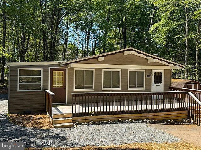 Welcome to this three-bedroom ranch home in Pocono Farms Country Club. This home features a beautiful warm knotty pine interior and updated appliances. Relax by the wood burning stove on cozy evenings and relax with large trees in the back yard on warm summer days. The new roof and vinal siding make this a low maintenance home. The community offers a professional golf course, Olympic size pool, a bar and great restaurant for dining. The community is close to your Pocono Attractions, waterparks, skiing, hiking and forests. Come to check it out! Both Pocono Farms Country Club and Coolbaugh Twp. are STR Friendly. Check to see that they meet your needs.