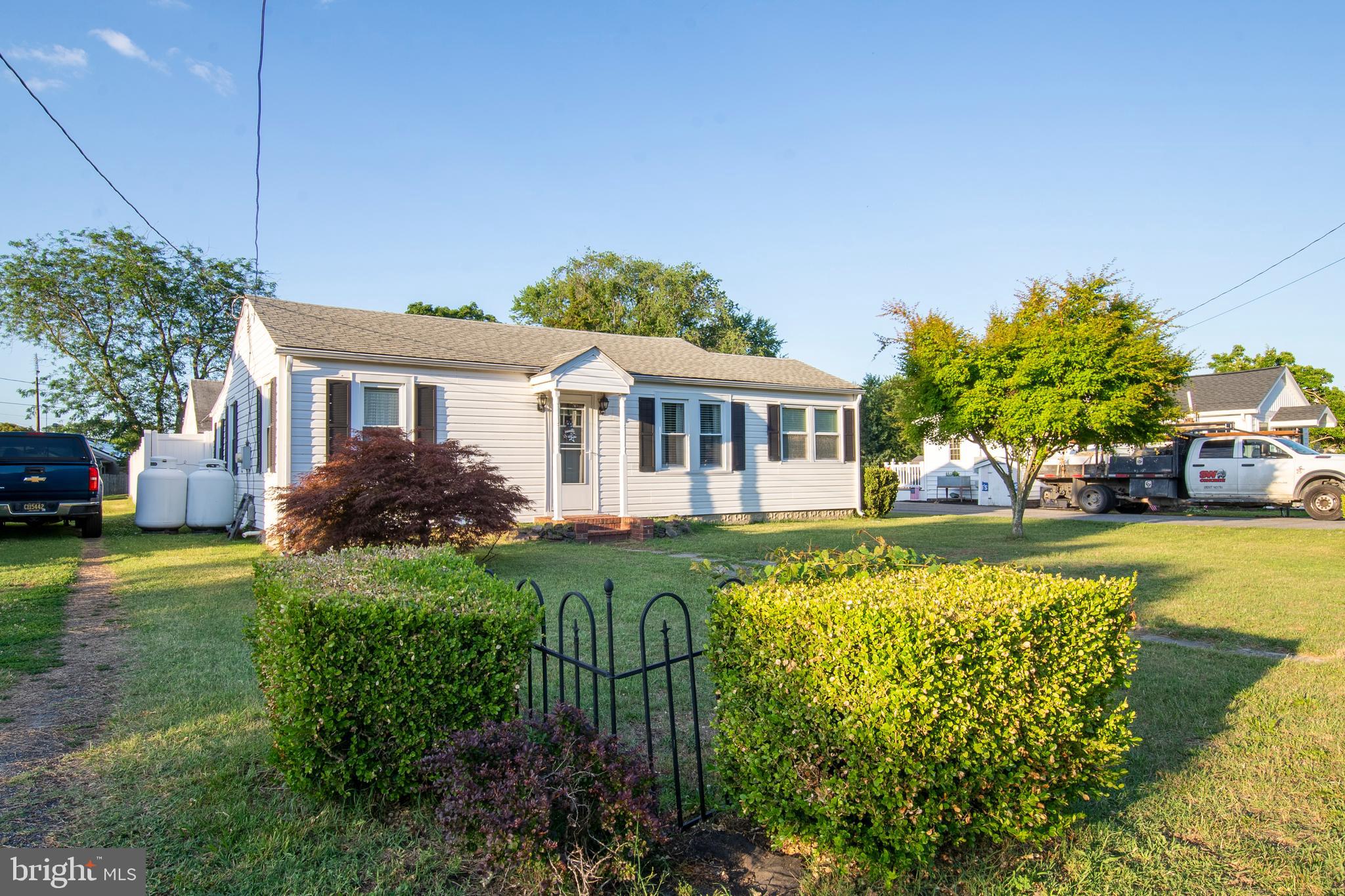 So close to the Delaware Bay, you can almost smell the salt air! This charming, clean, and well-maintained 2-bedroom, 1-bath bungalow offers affordable coastal living in a peaceful country setting. Inside, you'll find a welcoming living room with hardwood flooring, a formal dining room with wood floors, and a bright kitchen featuring oak cabinetry, appliances, and a spacious walk-in pantry. The updated full bath adds modern comfort, while the two generously sized bedrooms provide cozy retreats. A delightful sunroom with vintage decorative flooring offers the perfect space for a reading nook, home office, or flex room. Outside, enjoy a detached garage, a fenced backyard for added privacy, and an oversized driveway with plenty of room for your boat, RV, or additional vehicles. Conveniently located east of Route 1 with only Sussex County taxes, this home is approximately two miles from the shores of Slaughter Beach and just a short drive to Milford for shopping, dining, and professional services. The Delaware beaches of Lewes, Rehoboth, and Dewey are also within easy reach. Whether you're looking for a year-round residence, weekend getaway, or investment opportunity, this well-cared-for home offers the perfect blend of charm, location, and value.