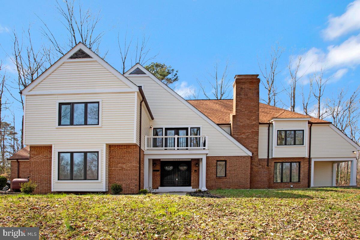 | Where Privacy Meets Presence |
Some homes make you pause at the door. | This is one of them. |
Set on over five acres of mature woodland in Saint Leonard, 4200 Henry Court is a renovated dramatic estate that commands attention from the moment you arrive. The bold double entry doors, brick exterior, and Juliet balcony above the portico signal something exceptional before you ever step inside.
| And then you do... |
A soaring two story foyer opens into one of the most dramatic living spaces in Calvert County. Hardwood floors stretch beneath cathedral ceilings, a statement staircase rises to the upper level, and natural light pours in from every direction. The great room anchors the main level with generous proportions designed for both everyday ease & effortless entertaining. A dedicated home office (flex room) with wooded views brings calm focus to the day.
The layout offers a very rare flexibility across 4 bedrooms and 3.5 baths. A main level in law suite with full bath, multiple formal and casual living areas, and 3 fireplaces create warmth & character throughout. The kitchen sits nicely between the great room and the formal dining for seamless flow that today's buyers expect.
Upstairs, the owner's retreat delivers!!  A private fireplace, spa bath with soaking tub, and generous proportions make this a true exceptional escape. A Juliet balcony along the upper hallway frames elevated views of the surrounding tree line, quiet, and quite cinematic.
The finished walkout basement extends the home further still, featuring a built in sauna, direct patio access, and the kind of flexible space that becomes whatever you want or need it to be.
Outside, over 5+ wooded acres create the privacy that most buyers only dream about. A rear deck and lower patio offer multiple settings for gathering or just sheer privacy. No neighbors pressing in. No noise. Just trees, sky, and the kind of peace that has real value.
Renovated in late 2025 this home has thoughtful updates throughout. |||Welcome to 4200 Henry Court |||

| KEY HIGHLIGHTS | 
4 bedrooms | 3.5 baths | Over 6,000 sq ft on 5+ wooded acres | Renovated late 2025 | Soaring two story family room | Dramatic entry staircase | Three fireplaces | Owner's suite with fireplace and spa bath | Main level in law suite | Home office with wooded views | Finished walkout basement with sauna | Rear deck and lower patio | Two car garage |  25 miles to NAS Patuxent River via MD-4 | Close to entertainment, shopping, restaurants, hospital, and more.  Priced well well below market.  Seller is motivated.  Make an offer today.