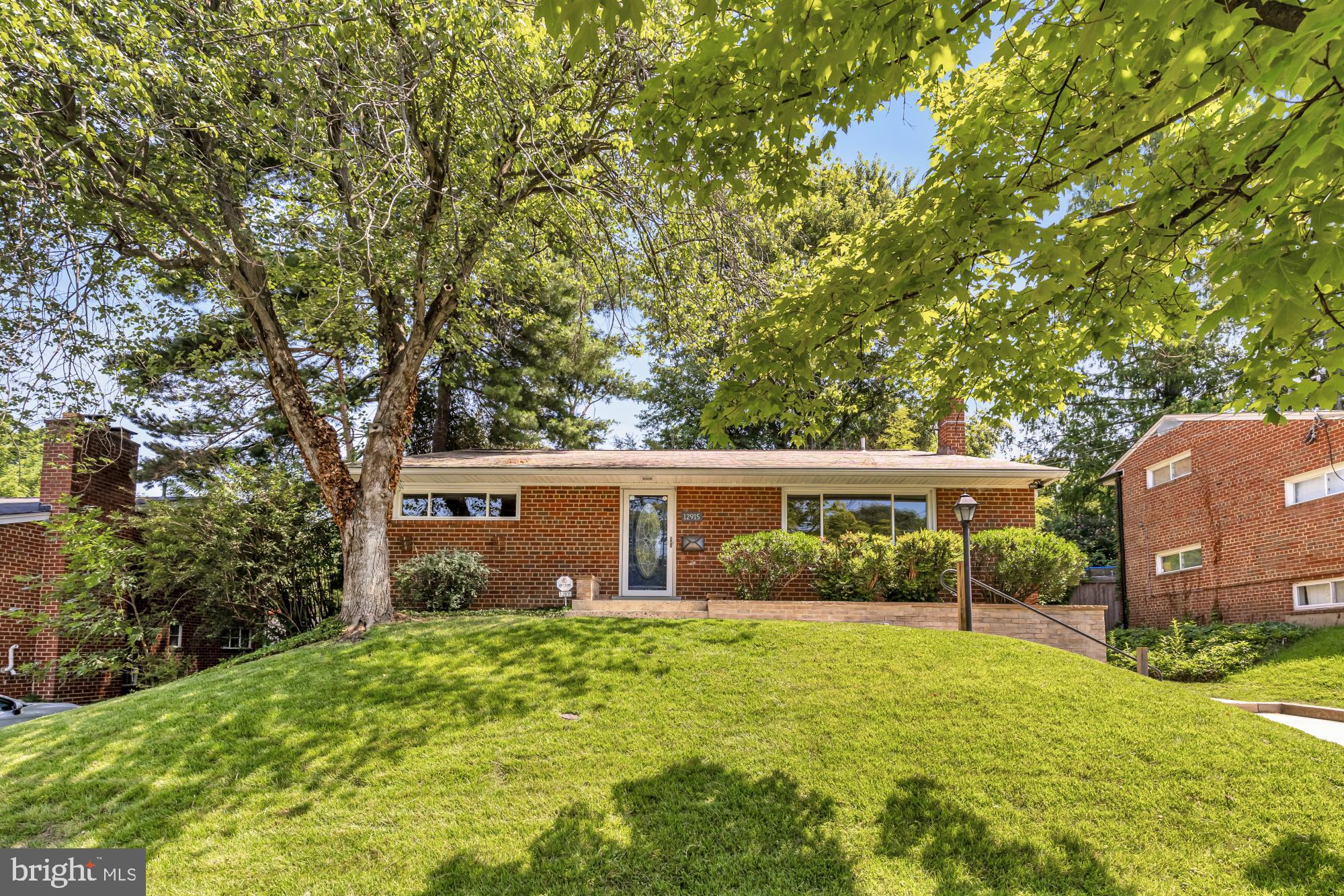 Welcome to 12915 Moray Road — Tucked into one of Silver Spring's most sought-after pockets, this beautifully maintained 4-bedroom, 2.5-bath split-level sits on a quiet street in Conn Ave Park — minutes from the Matthew Henson Trail, Wheaton Metro, and the shops and dining of Kensington and Pike & Rose. Step inside and feel the difference immediately. Refinished hardwood floors flow throughout the main and upper levels, warm and timeless underfoot. The kitchen has been thoughtfully updated with new luxury vinyl plank flooring, refreshed cabinetry hardware, fresh paint, a gas range with a dedicated new gas line, a Bosch dishwasher, and a new LG refrigerator — everything ready for the way you actually cook and live. The real story here is what you can't see: a $24,000 Carrier Infinity Hybrid heating system installed just three years ago — a 24 SEER heat pump paired with a 98% efficiency gas furnace, steam humidifier, iWave whole-home air purifier, 4" pleated filtration, and a smart WiFi thermostat. Two sources of heating, one extraordinarily efficient system. Your utility bills will notice. Four bedrooms give you room to breathe. The fully finished basement adds a brand new full bath and flexible space perfect for a guest suite, home office, or family room — plus the LG smart washer and dryer. Fresh paint throughout, new ceiling fans in the primary and front bedrooms, an upgraded bathroom exhaust fan, and a new water pressure regulator with quarter-turn ball valves round out a list of improvements that reflects genuine stewardship of this home.  Mechanicals, systems, finishes, function, care — and it shows in every room. Pre Inspections Welcome!