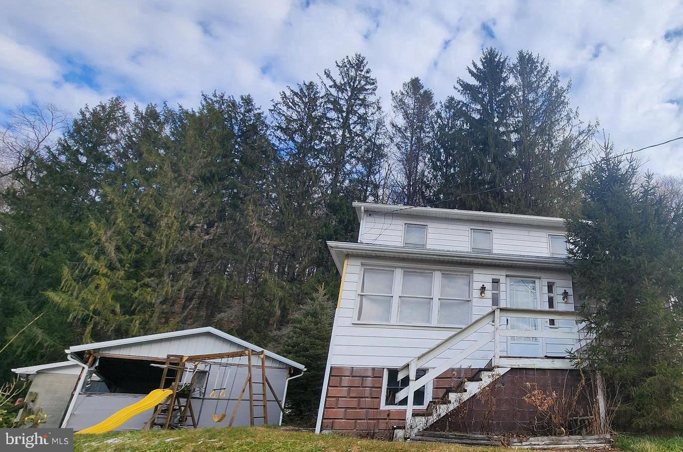 Farmhouse style home nestled in rural Mountain Side Maryland, 3 bedroom, 1 bath,  basement, gas hotwater heat, off street parking, 2 inclosed porches,  detached garage with room for a shop.  Selling below tax assesment and sold as is, has a shared driveway/right away.