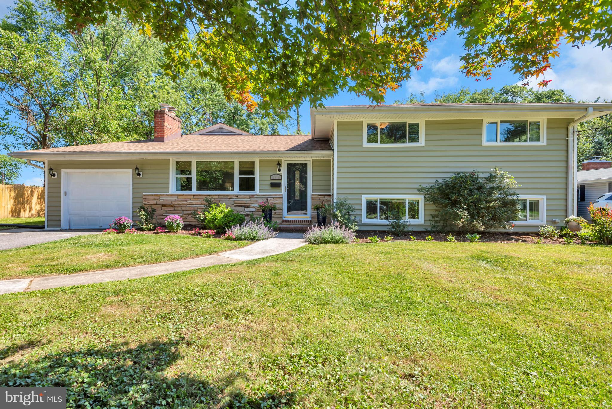 Welcome to 510 Evergreen Road, a move-in ready split level home located in the highly desirable Severna Gardens community of Severna Park. Offering just under 2,600 square feet of living space, this thoughtfully updated home combines a flexible layout, quality improvements, and one of the most walkable and convenient locations in the area. With four bedrooms, two full bathrooms, and two half bathrooms, the home provides comfortable everyday living with plenty of room for entertaining, guests, or multigenerational flexibility.
Inside, hardwood flooring runs throughout much of the home, creating a warm and cohesive feel across the living spaces. The updated kitchen features upgraded granite countertops, a tile backsplash, stainless steel appliances, and excellent workspace for both everyday use and hosting. One of the standout features of the home is the main level bedroom suite with its own en-suite bathroom, offering flexibility for guests, extended family, or private office space. Nearby, three additional bedrooms and a hallway bathroom are thoughtfully positioned together on the upper level. The home also features a finished lower level with walkout basement access, creating additional living and entertaining space with seamless connection to the backyard. Additional updates include an updated roof and a new water heater, helping provide peace of mind for the next owner.

The outdoor living spaces are equally inviting, with an attached screened-in porch that extends the living space for much of the year, a rear deck ideal for entertaining or relaxing, and a flat backyard offering excellent usability and flexibility. Mature landscaping and the established neighborhood setting add to the overall charm and curb appeal of the property.

Located just moments from downtown Severna Park, the location truly captures the quintessential Severna Park lifestyle. Enjoy convenient access to local shops, restaurants, coffee spots, and community events, all within close proximity. Popular local favorites including The Sugar Shack and Always Ice Cream Company have become staples of the downtown experience, while the renowned Severna River Swim Club is located just down the street. The home is also within walking distance to Severna Park High School and offers convenient access to local parks, waterfront amenities, walking trails, marinas, and commuter routes to Annapolis, Baltimore, and Washington, D.C.

Whether enjoying summer traditions, neighborhood events, or simply the everyday convenience of one of Severna Park’s most desirable locations, 510 Evergreen Road offers an exceptional opportunity to enjoy the lifestyle so many buyers are searching for.