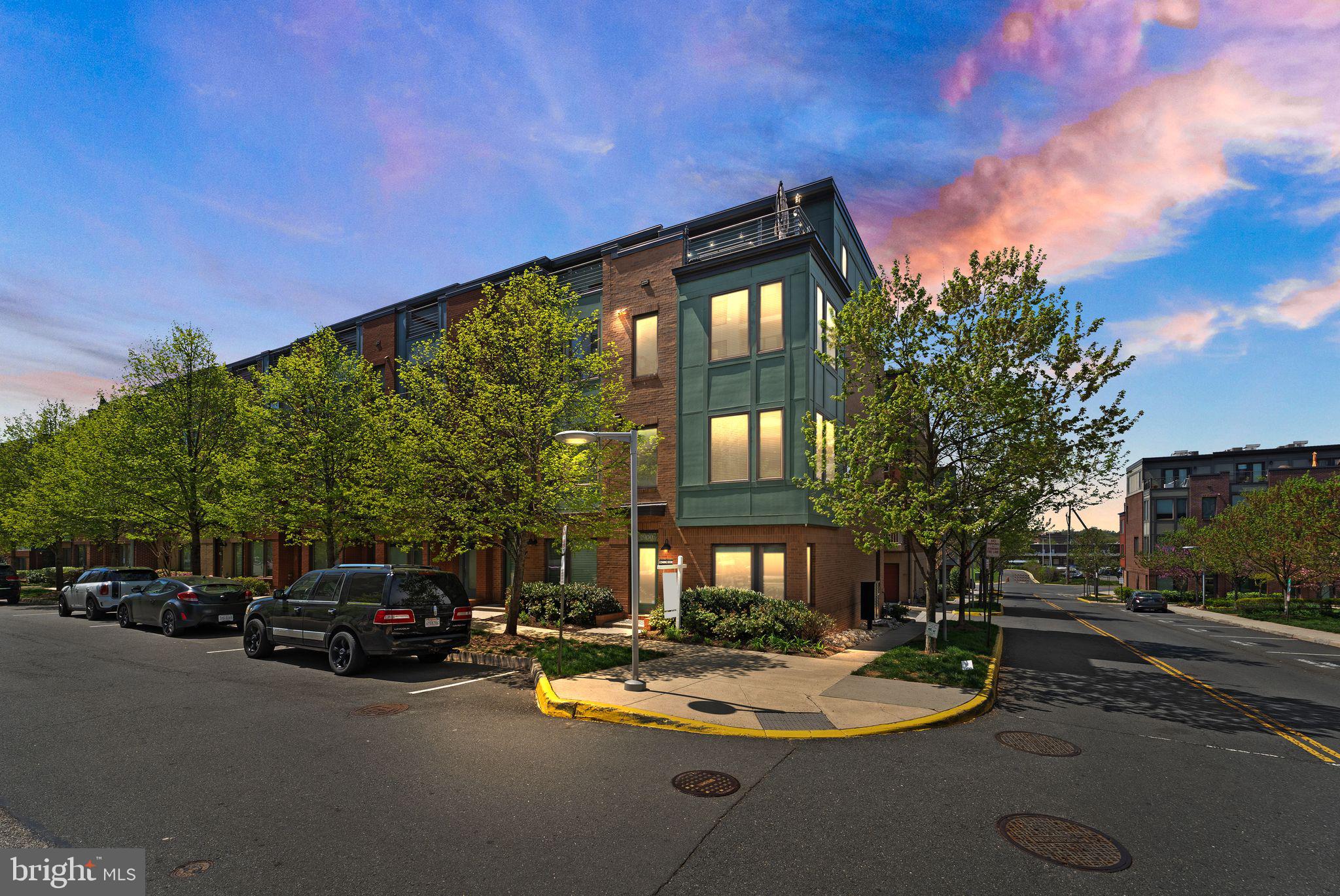 3.2% VA assumption for VA eligible buyers. 
Welcome to the epitome of modern luxury living in the vibrant heart of MOSAIC District!

Get ready to be WOWED by this spectacular townhouse, the LARGEST Bryant model boasting an impressive 2112 sq ft of living space, and a jaw-dropping $120K in top-of-the-line UPGRADES!

Step into your dream home and be greeted by a chef's paradise - the Gourmet kitchen is an entertainer's delight, featuring sleek countertops, premium appliances, and ample storage space. The open floor plan seamlessly connects the kitchen to the dining and living areas, perfect for hosting gatherings or relaxing in style.

Feel like royalty in the loft-style family room, where soaring ceilings and abundant natural light create an inviting atmosphere. And when it's time to unwind, head up to the rooftop terrace and cozy up by the indoor/outdoor fireplace, enjoying breathtaking views and fresh air year-round!

Luxury abounds with hardwoods throughout, windows galore bathing every corner in sunlight, and the convenience of a two-car rear load garage ensuring parking is a breeze.

But the perks don't end there! Immerse yourself in the bustling community life with retail shops and restaurants just steps away. Need to commute? No problem! Hop on the community shuttle to Dunn Loring METRO and zip around town with ease.

This home is not only stylish but also smart! Enjoy the latest in technology with new Sonos surround sound, brand new washer and dryer, as well as a new dishwasher and refrigerator.

With its prime location, end unit status flooding the space with natural light, and proximity to everything from restaurants and shopping to theaters, coffee shops, Target, and grocery stores, this townhouse offers the ultimate in convenience and luxury lifestyle.

Don't miss your chance to make this gem yours - schedule a viewing today and prepare to fall in love!