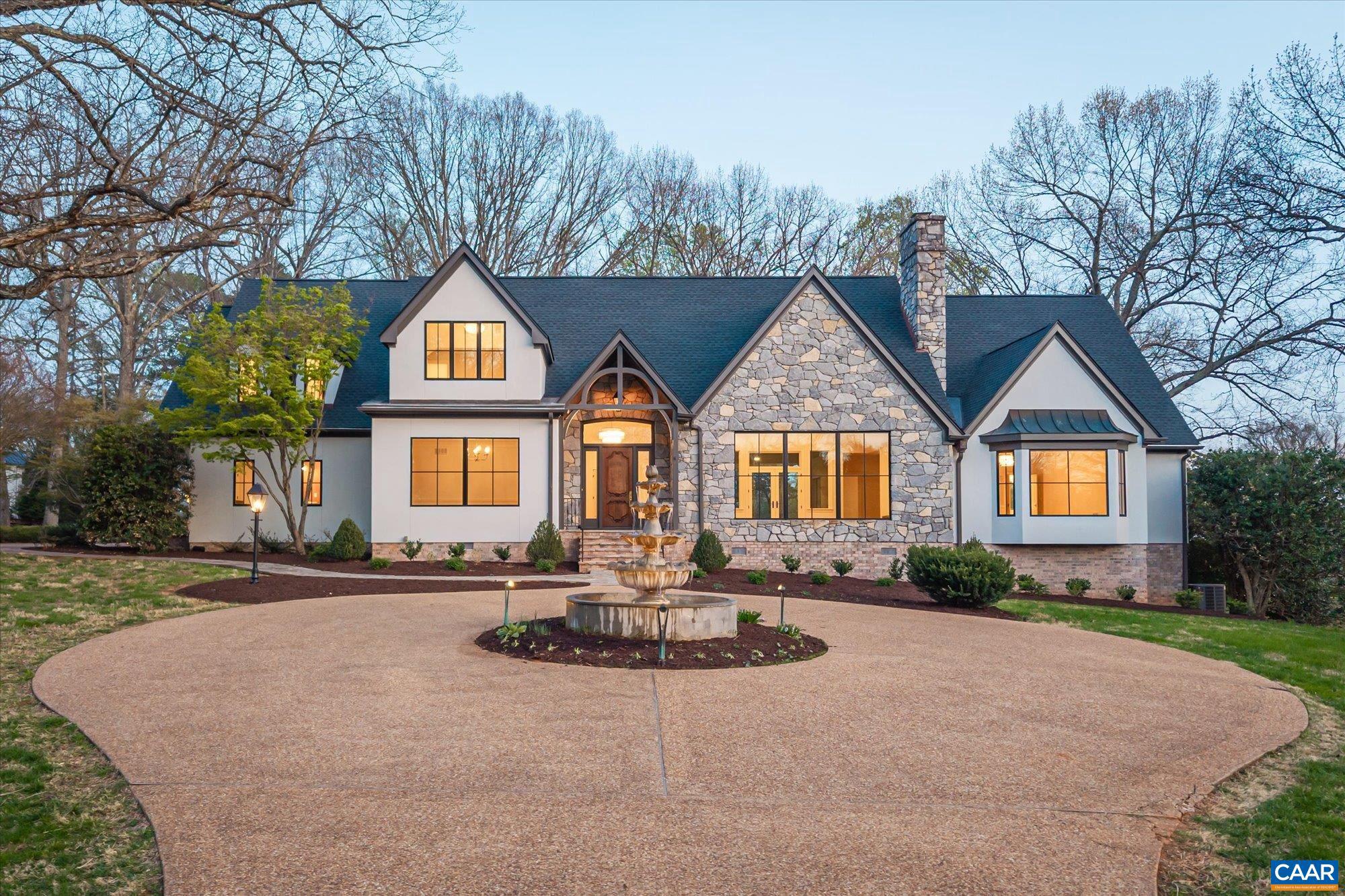 "Majestic Oaks" Set along coveted Garth Road just minutes from Charlottesville. This an exceptional 7 + acre estate offering rare privacy, refinement, and sweeping Blue Ridge vistas. Framed by mature oaks and curated landscaping, the approach is unforgettable, with a winding drive leading to a striking stone fountain and a true sense of arrival. The fully renovated 4-bed/4-bath residence offers a light-filled, open interior enhanced by new Pella Lifestyle windows, a new architectural roof, and fresh interior and exterior finishes throughout. Designed for both everyday living and elevated entertaining, the chef?s kitchen features Taj Mahal quartzite countertops, custom cabinetry, unlacquered brass hardware, and an expansive island. The primary suite serves as a private retreat, complete with a spa-inspired bath featuring marble floors, double walnut vanities, a clawfoot soaking tub, and a custom walk-in closet. Additional highlights include a sunroom, three-car garage, and seamless indoor-outdoor living. A covered stone terrace captures sunset views over the Blue Ridge Mountains, while the fully fenced grounds feature a serene koi pond and pastoral beauty. A rare offering in one of Albemarle County?s most prestigious settings.,Marble Counter,Wood Cabinets,Fireplace in Great Room