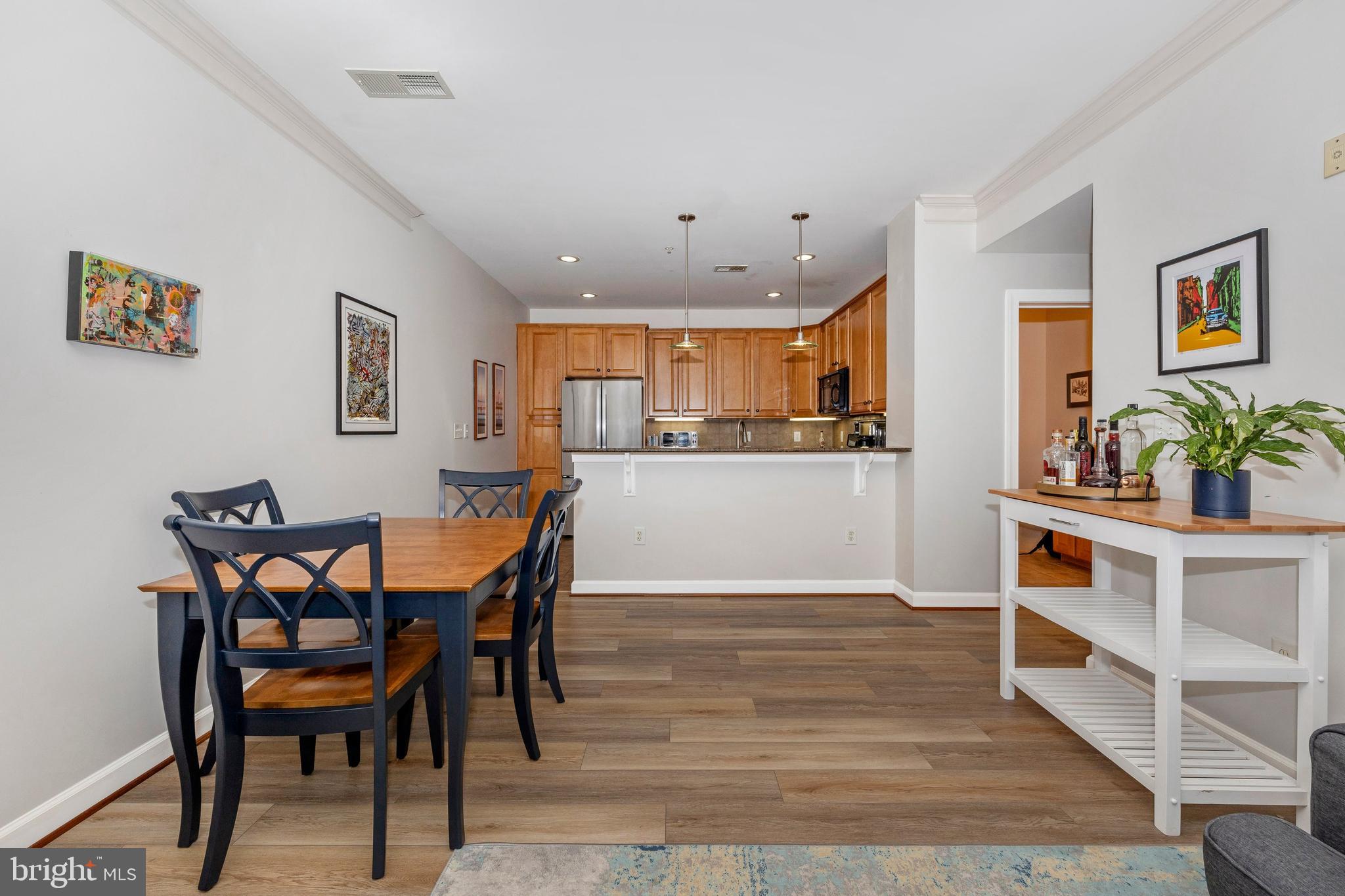 Your new home in downtown Frederick is ready for you! This spacious 1200 sq ft unit features 2 bedrooms, 2 baths, and stunning light wood floors throughout. With 9-foot ceilings, ceiling fans in every room, and ample storage space, comfort is guaranteed. Enjoy the convenience of a private storage unit, a designated parking space in the garage, and access to a fitness room.

The kitchen is a dream, with cherry cabinets, brand-new stainless steel appliances, and sleek granite countertops. Down the hallway, you’ll find a massive primary suite with an oversized walk-in closet and plenty of room for a large bed, furniture, and even a cozy seating area or office space. The second bedroom is perfect for guests, work, or play.

Maxwell Place is perfectly situated along Carroll Creek, offering easy access to Frederick’s best restaurants, bars, shops, and entertainment. With a walkability score of 97, everything you need is just steps away. This home truly has it all! Don’t miss out!