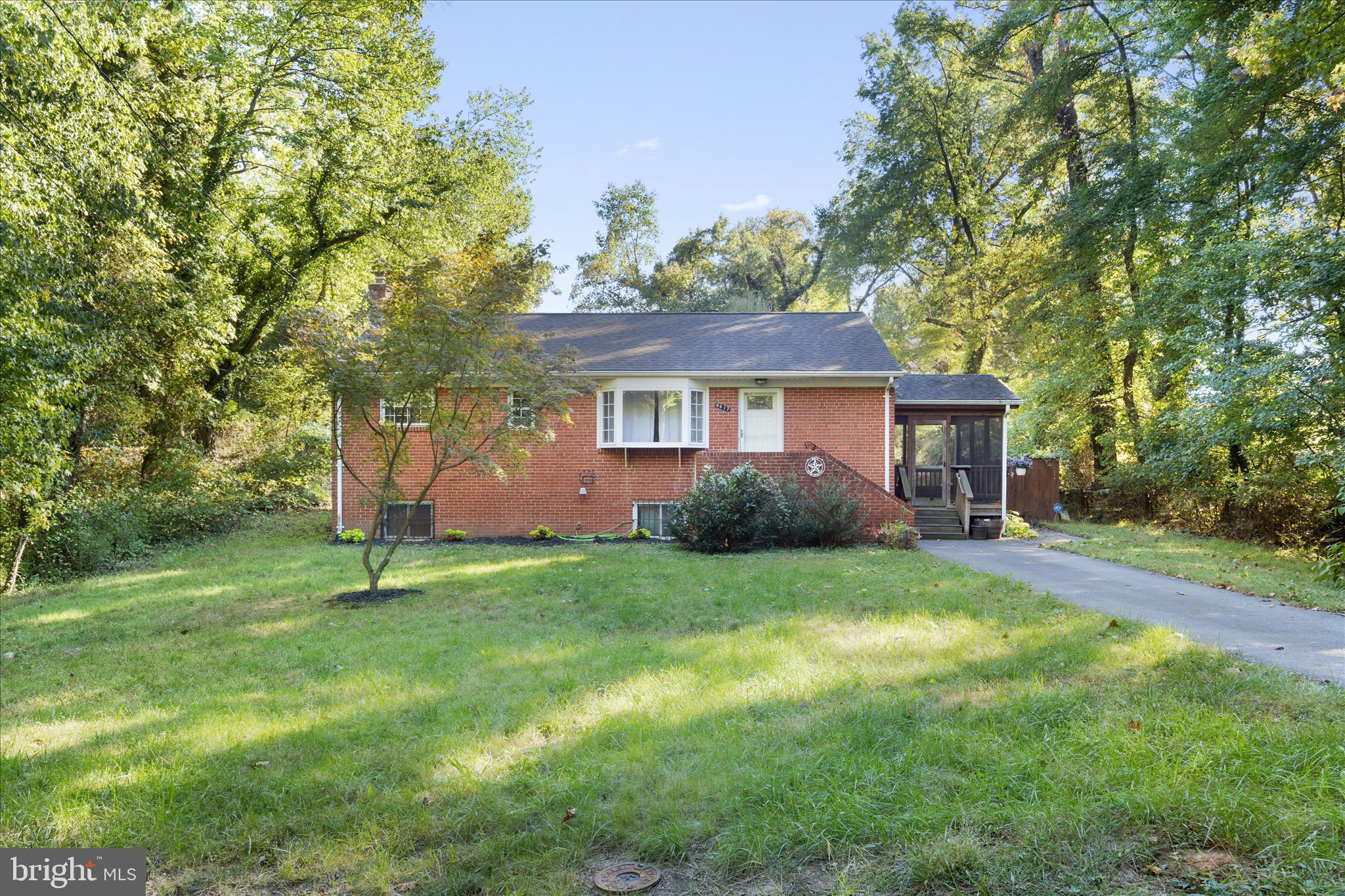 Privacy, privacy, privacy! Located at the end of a wooded street with only one neighbor, this 3-bedroom, 2-bath single-family home is surrounded by lush woods on all four sides, providing a serene, natural escape from the hustle of the city while still being close enough to urban conveniences like shopping, public transportation, and all major routes in and out of DC. 

Step inside to find hardwood floors gleaming throughout the main level and spacious living room. The eat-in kitchen has stainless steel appliances, a dining area and a spacious pantry. Enjoy the large screened-in side porch, ideal for relaxing at the start or end of your day. Downstairs, you'll find a finished basement with updated tile flooring, a second living room with a fireplace, a separate laundry room, and additional storage, including a dedicated pantry space. The basement also offers a walk-out to the private rear patio—an ideal spot for outdoor gatherings and grilling. The fully fenced-in backyard is perfect for pets and play! 

Additional features include updated bathrooms, large bedrooms, gutter guards installed in 2022, and a shed for outdoor storage. The property boasts ample parking with a private driveway and room for guests at the street. This home has it all—privacy, nature, and modern comforts. In this one, you get the convenience of Cheverly’s location (across Landover Road) but without Cheverly’s higher taxes!