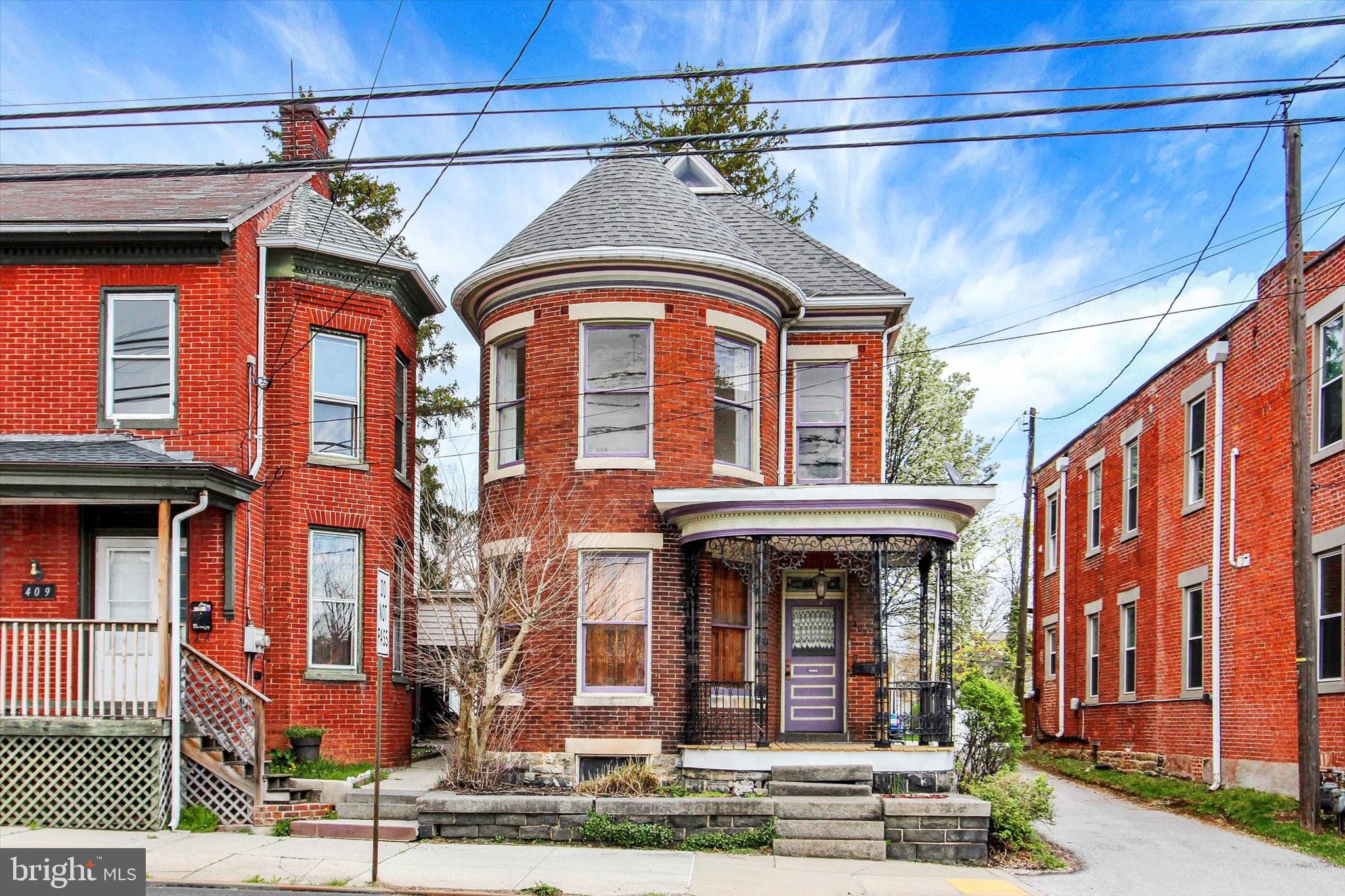 Welcome to a rare opportunity to own a beautifully preserved historic residence where original craftsmanship and architectural detail remain remarkably intact. From the moment you arrive, the home’s distinctive curved façade, ornate ironwork, and inviting front porch set the tone for what lies within.

Inside, you’ll find a level of character that is increasingly hard to replicate—original hardwood floors, intricate millwork, decorative cast iron radiators, and thoughtfully preserved hardware throughout. Natural light pours through a stunning stained glass transom, adding warmth and color while highlighting the home’s timeless design.

The spacious layout offers both functionality and charm, with generously sized rooms and unique period features that create a one-of-a-kind living experience. Additional historic elements, including original interior shutters and vintage lighting details, further enhance the home’s authenticity.

A detached rear structure offers flexible space for storage, workspace, or a she-shed, adding an extra layer of versatility to the property.

This is more than a home—it’s a preserved piece of architectural history with character, presence, and potential. A truly special property for those who appreciate craftsmanship, detail, and something that cannot be duplicated.
