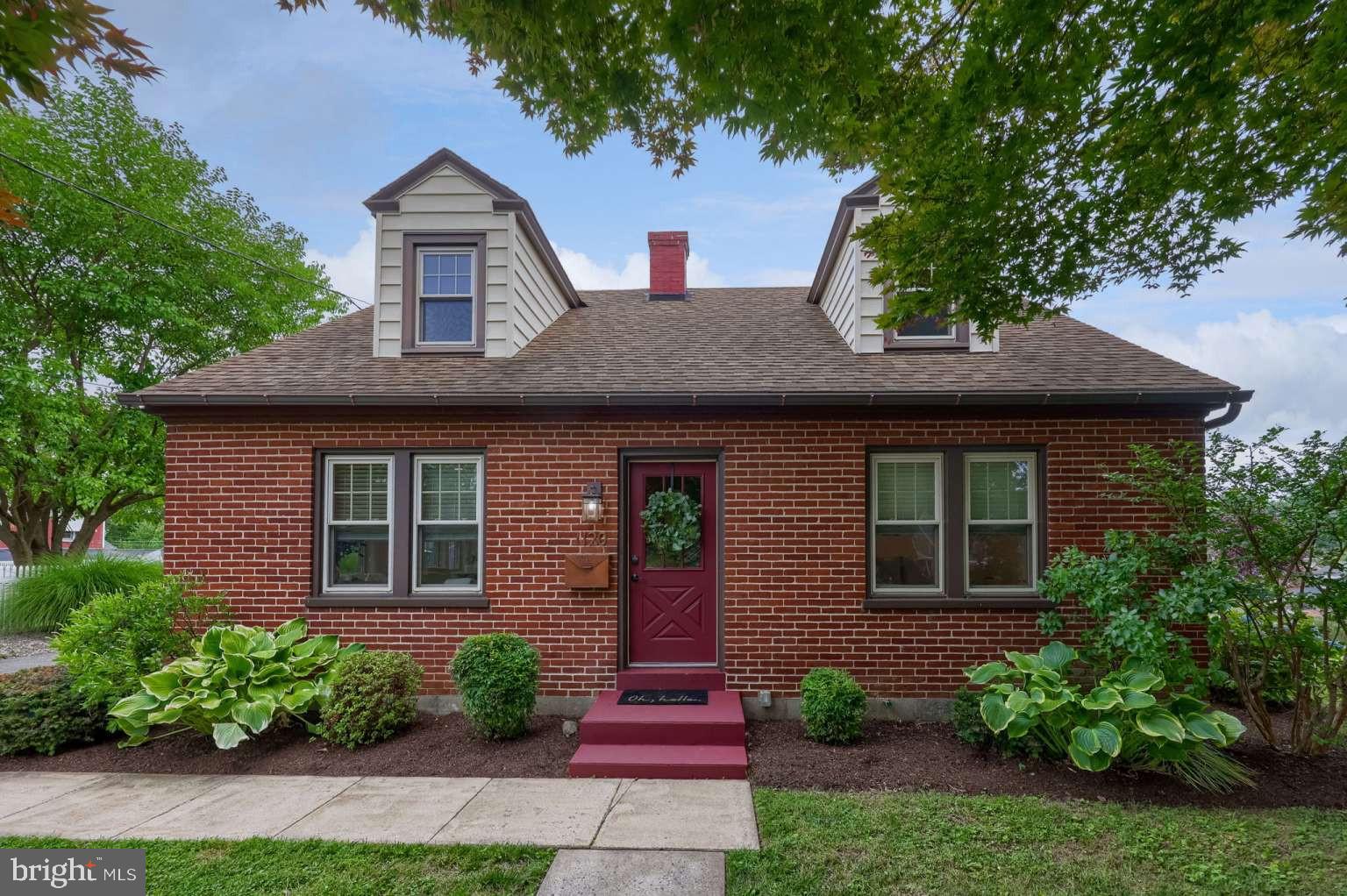 Check out this rare Lancaster City property that has had only two owners! This renovated brick Cape Cod features a large sun porch and sits on nearly a 3/4-acre lot. The property also includes a detached shop, a one-car garage, and an approximately 300-square-foot finished space above the shop that would make a great office, studio, or bonus room. The main floor of the house features an open-concept layout with the kitchen, dining, and living areas, along with a small entryway. The primary bedroom and an additional bedroom are also located on the main floor, as well as a full bathroom. Upstairs, you'll find two more spacious bedrooms and additional storage. The semi-finished basement includes a half bathroom and a laundry room. The home was fully renovated in 2019 with all-new wiring, a 200-amp electrical panel, a new propane burner for the boiler, and radiant floor heating installed kitchen, dining, and living room space. The renovation also included a new kitchen with quartz countertops and a tile backsplash, and the bathroom with a tile tub surround. Finished oak and pine hardwood floors run throughout the home. In 2025, a new heat pump with a whole-house air purifier was installed, providing central air conditioning and a secondary heat source. A driveway leads to the detached one-car garage and shop. The shop is insulated with spray foam in both the walls and ceiling. The finished second floor has been used as an office and offers a flexible space for work or hobbies. The outdoor space features mature landscaping and a variety of fruit trees and bushes, including Asian pears, apples, peaches, figs, cherries, blueberries, and raspberries. All of this is within walking distance of downtown Lancaster and everything Lancaster City has to offer, yet you'll come home to the privacy of off-street parking and a spacious yard. Don't miss this beautiful property—schedule your showing today!