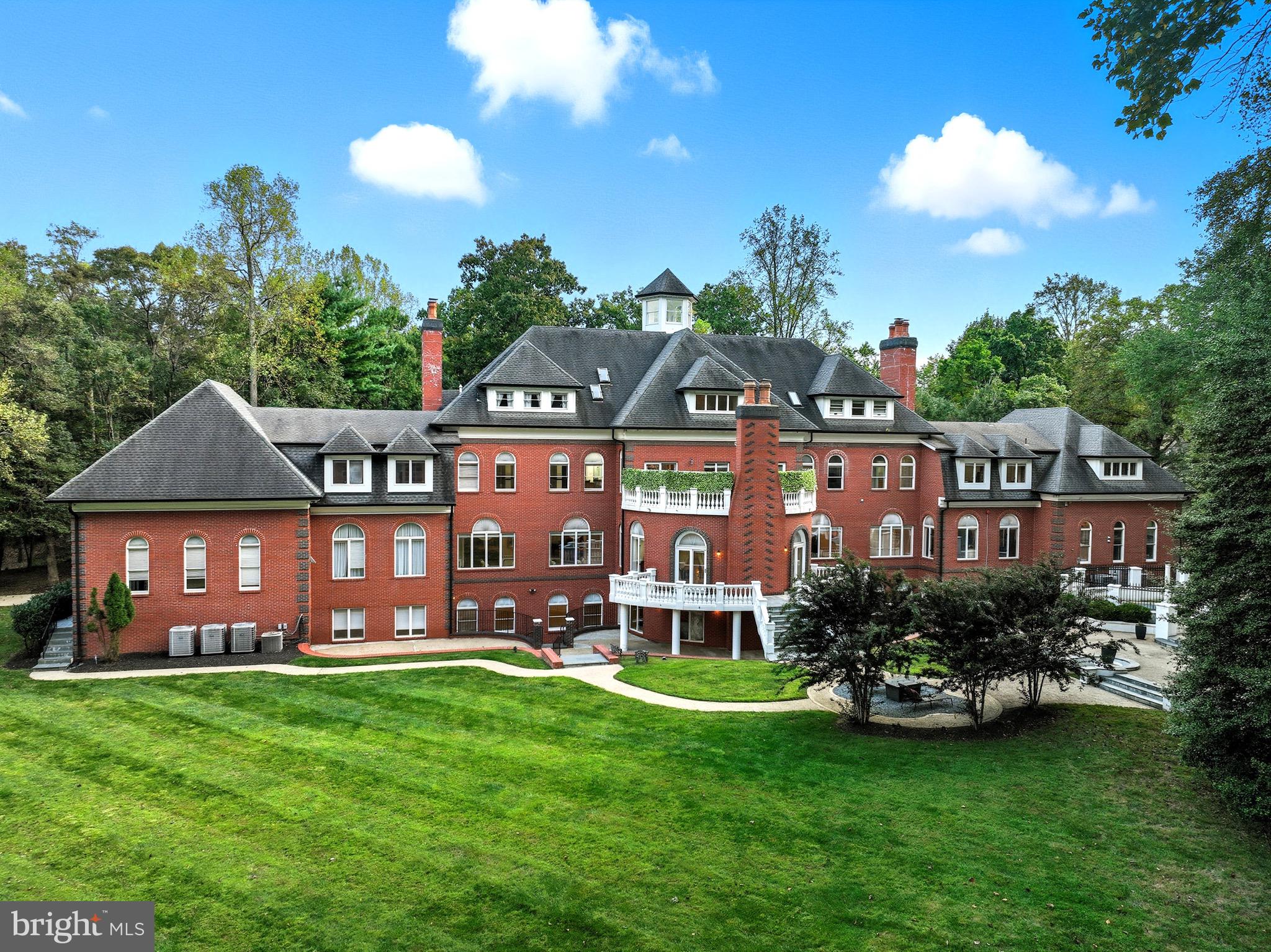 Incredible opportunity! This spectacular custom-built estate offers over 20,000 sq. ft. of luxurious living space on nearly 2 acres, ideally located at the border of Reston, Vienna, and Oakton in the heart of Northern Virginia’s tech corridor. Constructed with commercial-grade concrete and steel beam design, this home is built to impress and endure. Designed for both grand entertaining and everyday comfort, the residence features embassy-sized living and dining rooms, multiple kitchens including a full secondary kitchen ideal for for use as a catering kitchen, and an array of outdoor terraces. The lower level offers exceptional flexibility, easily accommodating business conference rooms, private office space, a fully equipped gym, or additional entertaining areas. Eight bedrooms, eleven full baths, and eight fireplaces provide abundant space for multi-generational living, while indoor and outdoor pools with spa create a true resort-style atmosphere. Access all 4 luxurious levels with your private elevator. Located just minutes from Tysons Corner, Reston Town Center, Dulles International Airport, major commuter routes, and downtown DC—and with no HOA—this one-of-a-kind estate offers unmatched convenience and lifestyle.