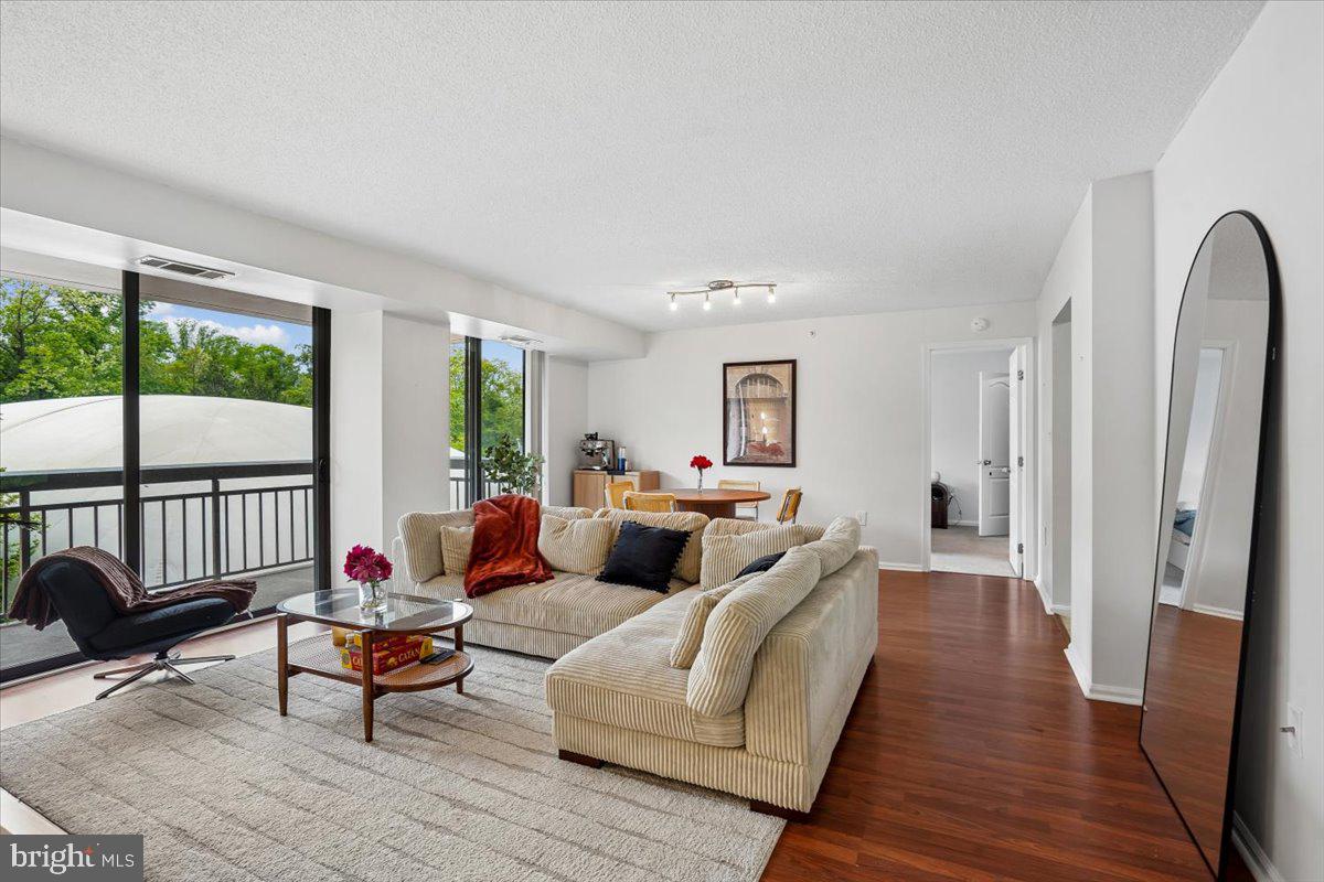 Bright and sunny 2BR/2BA unit with double sliding doors onto a spacious balcony. Situated on 21+ gated and fenced wooded acres, the Renaissance at Tysons offers a lushly landscaped oasis of calm yet is just down the street to Tysons Corner and Falls Church City. The well-appointed kitchen  is the heart of the home, equipped with stainless steel appliances, granite countertops, and marble flooring. Bathrooms also have granite counters and marble floors. Renaissance amenities are exceptional, with a fitness center, outdoor pool, tennis courts, picnic area with new grills, charging station, 24/7 monitored security and staffed front desk 24/7. Experience the vibrant lifestyle of Tysons, where comfort meets convenience. This is more than just a home; it's a lifestyle waiting for you to embrace. Note: updated photos coming Thursday.