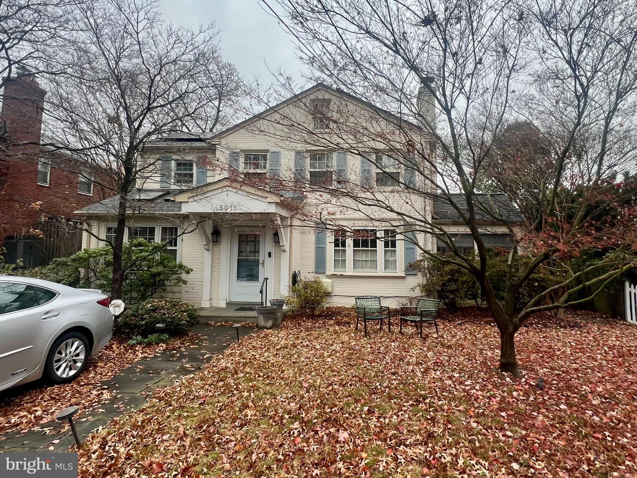 A true diamond in the rough!  This handsome brick Colonial is ideally located in the tree-lined Westbrook Neighborhood, offering all of the charm of suburban life while maintaining the advantages of urban living. With timeless curb appeal, this five bedroom and five full bathroom home is light-filled and ready for your big ideas and updates.

This is a strictly as-is sale. Classic layout with opportunity to update. Home features a main level den / bedroom with built-in bookshelves and skylights, side entry, full bath, and another home office.  The formal living room enjoys a fireplace and opens to a screened-in porch framed by mature plantings for privacy. The separate dining room leads directly into the expanded kitchen and large family room, where a cheerful breakfast nook, center island, and two sets of glass doors flood the space with natural light and connect seamlessly to the rear stone patio and fenced backyard.

Upstairs is a spacious primary suite with cathedral ceilings, an open walk-in closet, and a large en suite bath. Three additional bedrooms and two full bathrooms complete the second floor, with generous attic storage above.

The finished lower level offers exceptional flexibility with a recreation room, another full bath, and a work room with a wet bar and sink. With ample space and the right vision, it could easily transform into an additional bedroom suite or studio.

Additional amenities include a driveway for off-street parking, solar panels, and mature flowering trees and plantings. 5015 Allan Road benefits from surrounding parks, top-rated schools, and quick access to Friendship Heights Metro and major commuter routes, making travel to Bethesda, Friendship Heights, Chevy Chase, and Tenleytown remarkably convenient.

A classic Yorktown Village home with strong natural light and undeniable potential.