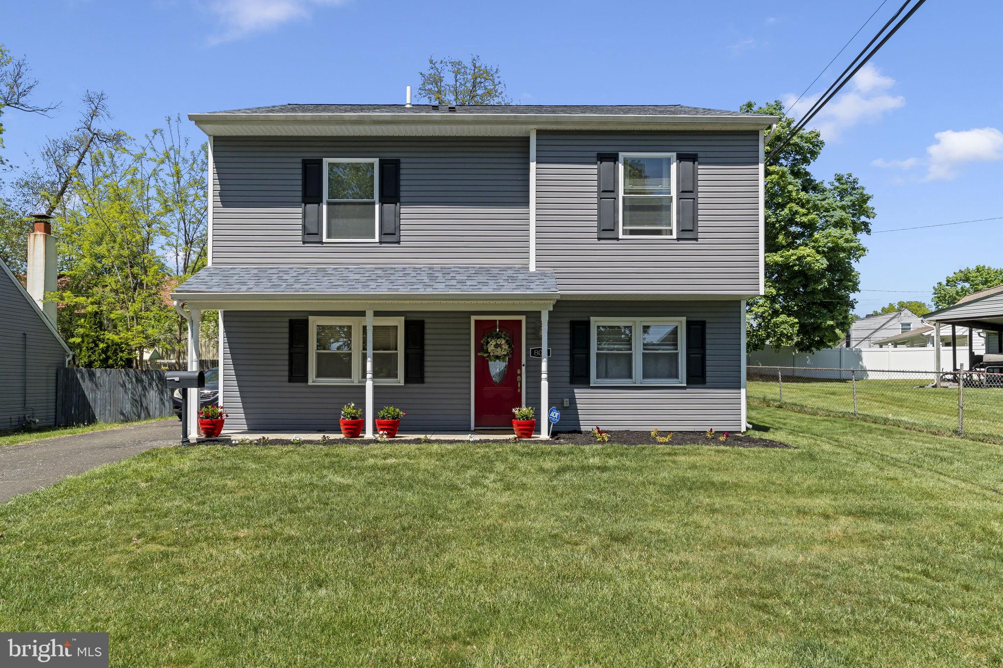 BACK on the market due to buyer financing. Welcome to this stunning 4-bedroom, 3 full baths, colonial style home nestled in the Morrisville area, offering charming curb appeal, thoughtfully designed layout. Step inside to discover a bright and open floor plan, featuring a spacious living and dining area with durable cortex vinyl flooring perfect for both relaxing and entertaining. The eat in kitchen offers tile flooring, tile backsplash and convenient access to the 3-car driveway. The main level also includes recessed lighting in the living room, laundry area w/d, pantry/closet, utility closet with tankless water heater, linen closed and a full neutral tone tile full bathroom, providing exceptional convenience, storage and functionality. A versatile fourth bedroom on the main level offers endless possibilities as a guest room, home office or den. Upstairs, you'll find three generously sized bedrooms with wall-to-wall carpeting and fresh paint throughout. The serene primary bedroom features a private full bath with walk in tile shower, linen closet, spacious walk-in closet, an additional large closet, and a cozy seating area. The second and third bedrooms are both well proportioned, offering abundant closet space and natural light. The attic is the full length of home and has central air. Step outside to your fully fenced backyard a generous private oasis ideal for barbecues, gardening or simply unwinding. Conveniently located just minutes from major roadways, shopping, restaurants, and commuter routes to New Jersey, New York and Philadelphia. This exceptional home combines comfort, style and accessibility.  Active cameras on exterior property. Schedule your private showing today.