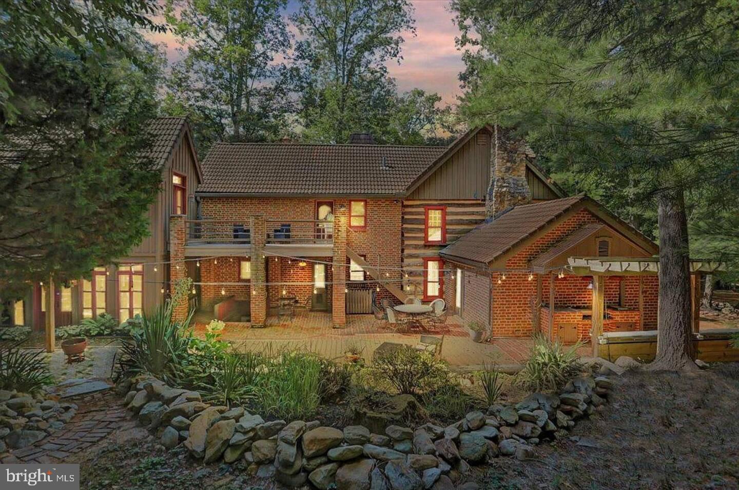 Discover an enchanting retreat nestled within 16+/- acres of Pennsylvania woodlands at 995 Black Gap Road. This beautiful, custom-built home, crafted with reclaimed materials, brings timeless character together with thoughtful, modern upgrades. Built in 1987 and thoughtfully expanded in 2000, with upgrades in 2023, this home offers vast living spaces, perfect for both relaxation and entertaining. Step inside and be greeted by a warm, inviting atmosphere where exposed beams, brick accents, and seven unique fireplaces create a setting that feels both grand and intimate. 
 
The heart of the home is a gourmet kitchen, equipped with soapstone countertops, a high-end ILVE range, and stainless steel appliances. It flows effortlessly into a family room with one of the home’s many fireplaces, creating the ideal gathering space. The dining room, with its atrium-inspired design, invites sunlight and showcases stunning views of the natural surroundings. Each of the five bedrooms presents its own character, from vaulted ceilings and wood beams to cozy fireplaces and private balconies, offering serene spaces to unwind. 
 
The finished basement provides entertainment on another level, featuring a movie theater area, game room, and additional storage. Outside, you’ll find numerous spaces for gathering, from a pergola-shaded patio to a brick walkway leading to an outdoor fireplace, all enhancing the property’s appeal for hosting or quiet reflection.  
 
With a proven record of Airbnb success and used as the occasional wedding venue, this property not only serves as a peaceful residence but also offers an attractive investment opportunity. Whether you are looking to expand on your real estate investment portfolio or have your very own private home, this property comes fully furnished, is turn-key and ready to use! 
 
 Additional features include a detached garage - shop, a spacious outbuilding perfect for projects or storage, and a newly installed outdoor wood-burning stove with dedicated wood storage. Timber value has been estimated to value roughly $20,000 for a select cut to include clearing around the house if desired a more open landscape. This property is truly a rare gem for those seeking a home rich in charm, character, and uniqueness.